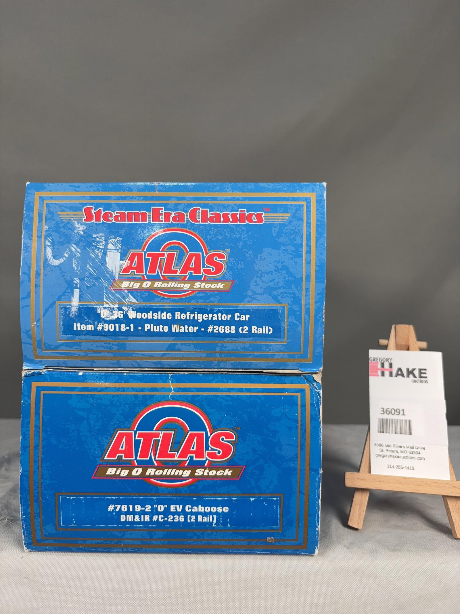 2 Atlas O Scale Refrigerator & Caboose Cars w/OB's: 2 Atlas O Scale Pluto Water 9018-1 Refrigerator & DM&IR 7619-2 Caboose Cars w/OB's, C8. Size 17x6x8