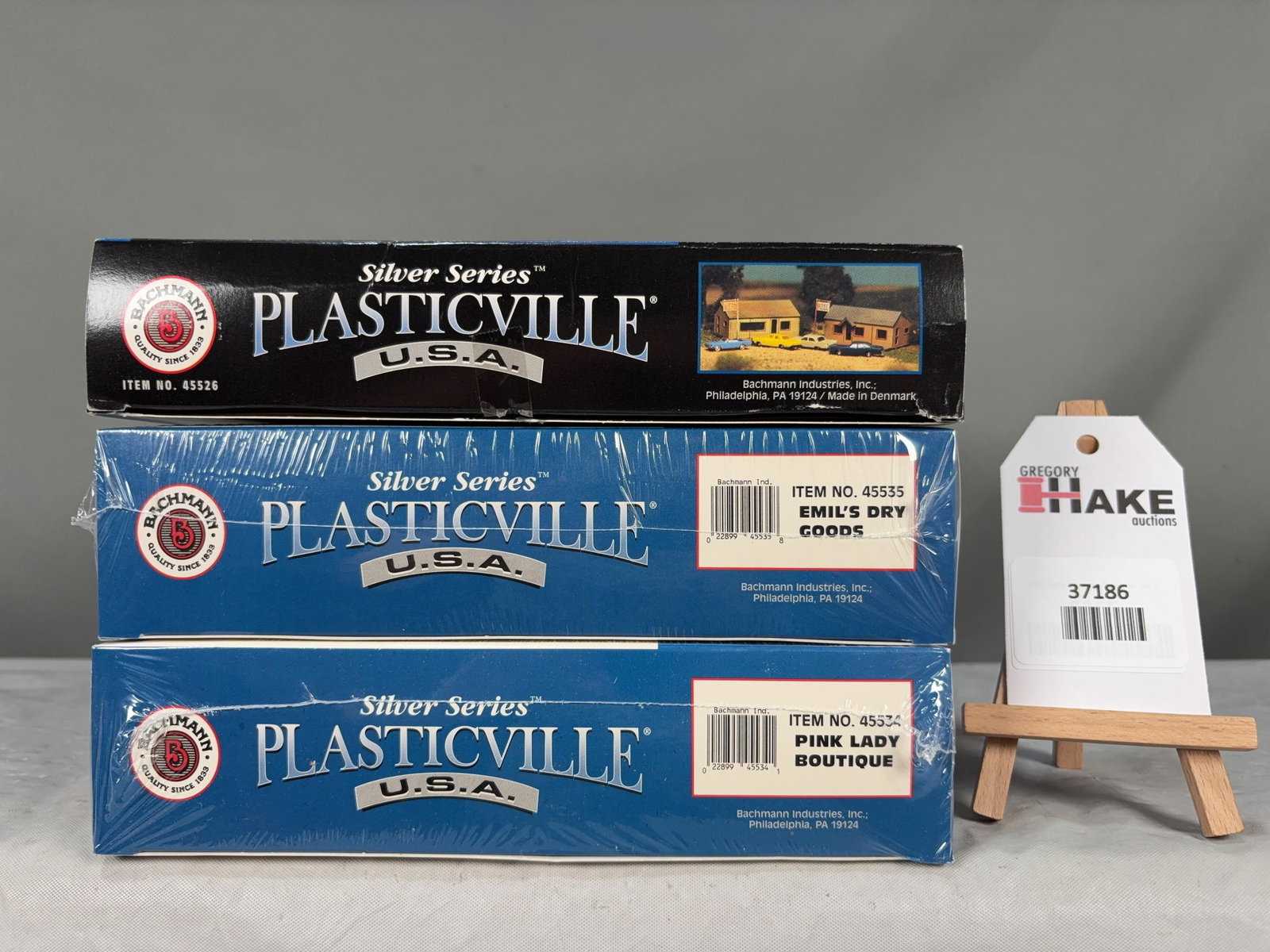 3 Bachmann Silver Series Plasticville Building Structure Kits w/OB: 3 Bachmann Silver Series Plasticville Building Structure Kits w/OB. Emil's Dry Goods 45535, Pink Lady Boutique 45534, Joe's Pizza & Video Store 45526, C9.� Size 12x9x6