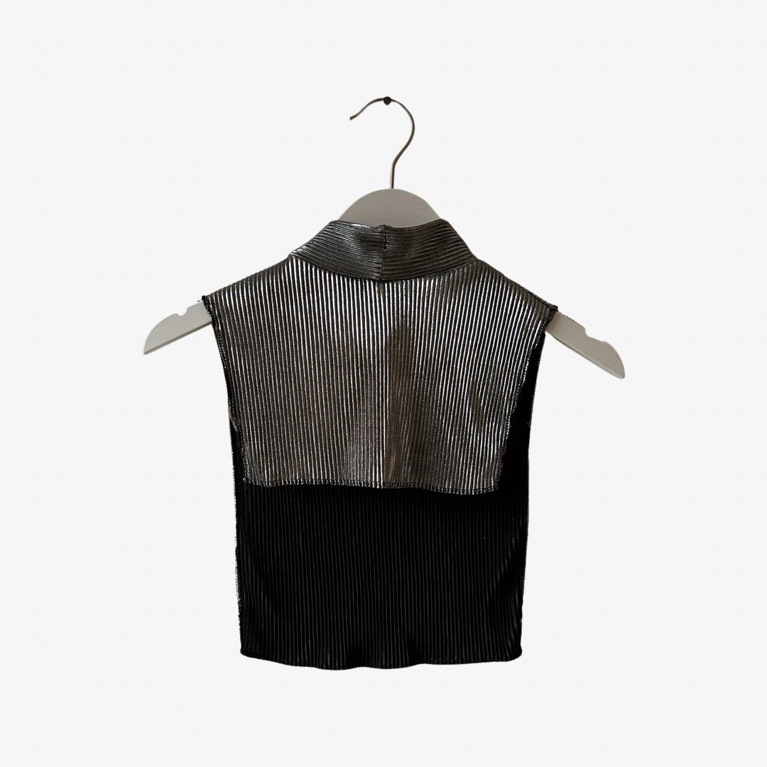 Strangers With Candy/Jerri Blank Metallic Silver Crop-Top: Jerri Blank costume!Perfect for layering, this metallic silver crop-top has a mock-neck collar, zip closure in the back, and open sides. Size S. 100% Polyester.