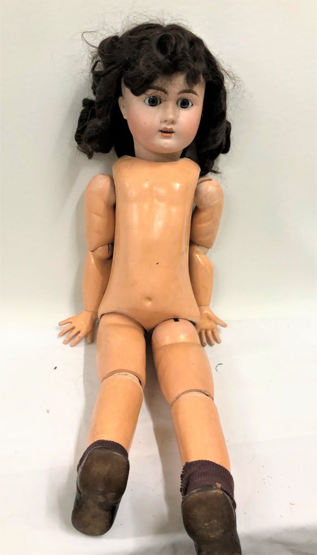 Antique Jointed Body Porcelain Head Doll: Antique Jointed body doll. Porcelain Face, hand painted. Fixed blue eyes. Signed Julian Dimensions: 30 inches tall x 9 inches wide . 6 inch face Condition: Good Please feel free to ask for a condition