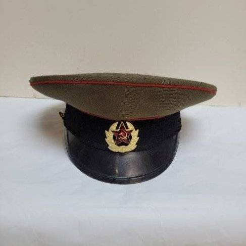 Vintage Russian Naval Dress Cap: Vintage Russian Naval Dress cap signed inside. Dimensions: 11 inches high x 11 inches in Diameter. Condition: Good with one gold button missing on the left side of the cap. Please feel free to ask for