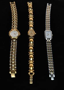 Lot of 3 Gold Tone Women's Watches: This lot features three gold-color women's watches: two Seiko watches and one Pulsar, a Seiko subsidiary. Each watch showcases a gold-tone case and bracelet, with elegant dials featuring minimalist ma
