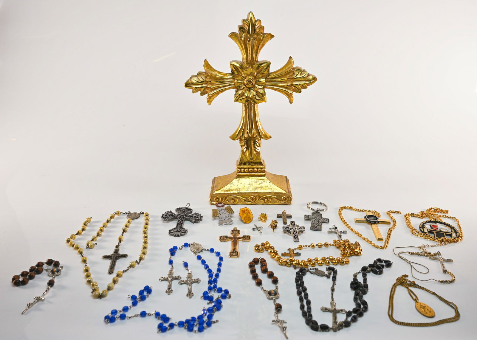 Lot of Large Crucifix and Christian Costume Jewelry: For the enthusiast who appreciates Christian accessories. Includes several rosaries, pins, necklaces, and other assorted jewelry. Large crucifix measures approximately 8.5"H.