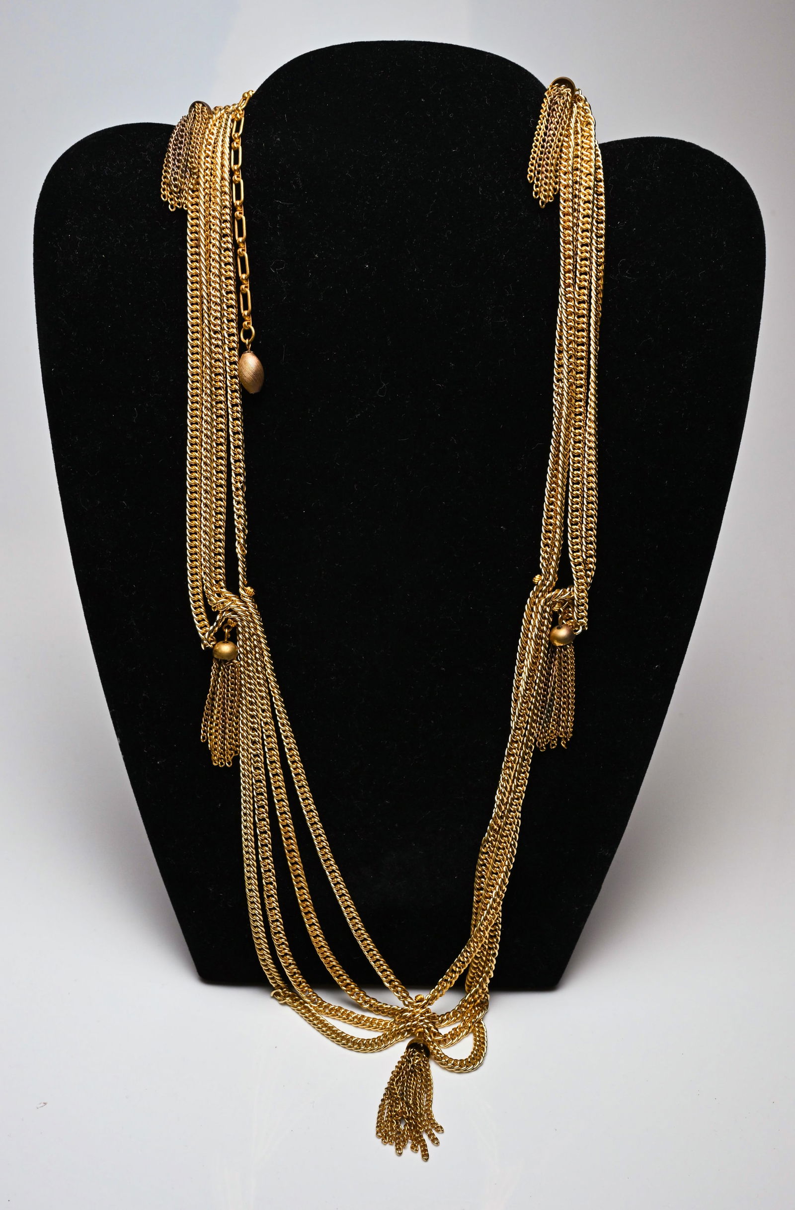 Retro 1960s Gold Tone Tassel Necklace Deco Style: Elegant vintage gold tone strapped necklace. Perfect for enthusiasts of mid-century costume jewelry.