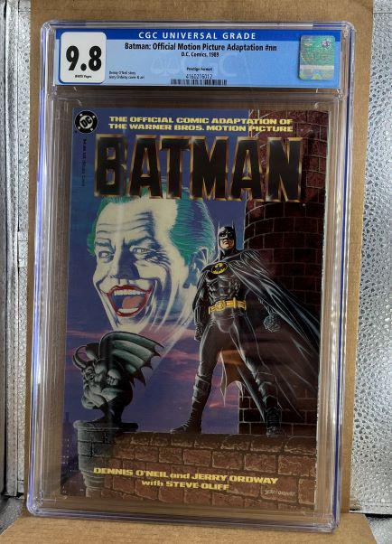 Batman Official Motion Picture Adaption CGC 9.8: We are Veteran Owned and Operated and we now do in-house shipping for all items!