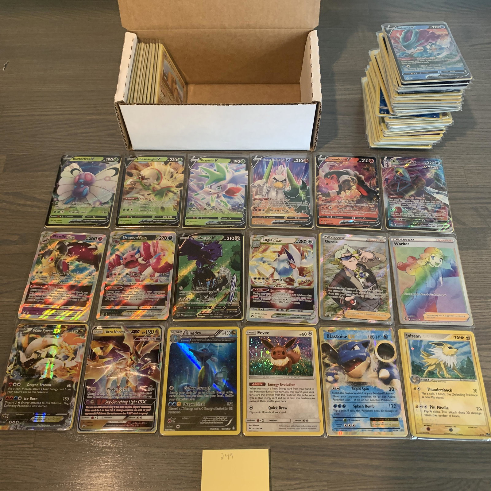Box of Modern Pokemon cards: 100s of Modern Pokemon cards. Includes Vs, Ex, Vmax, holos, Reverse holos, etc. See photos for conditions. Now accepting Consignments!