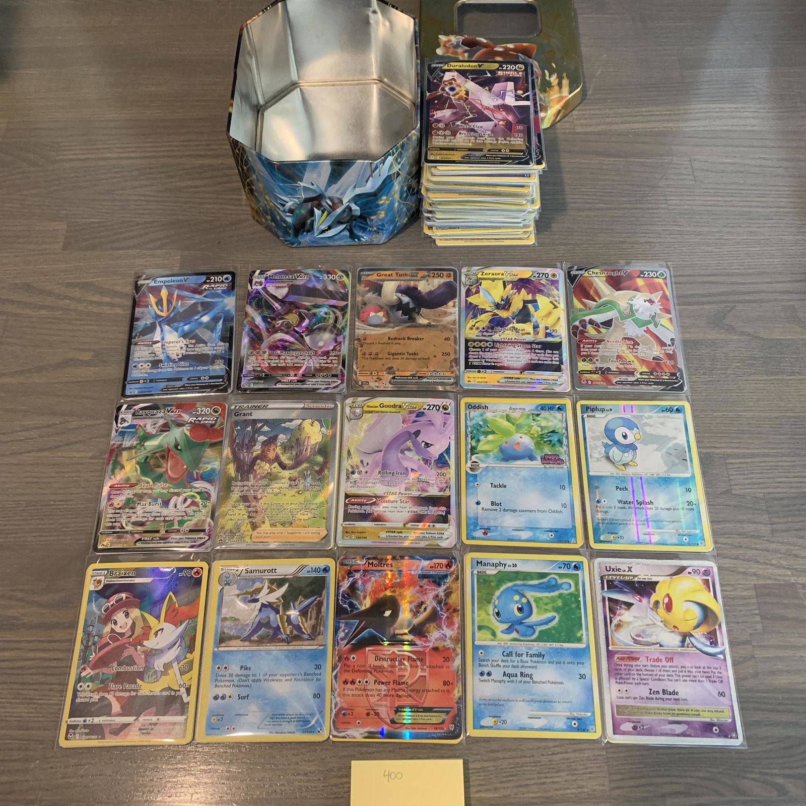 Lot of Pokemon cards and tin (1 of 3)