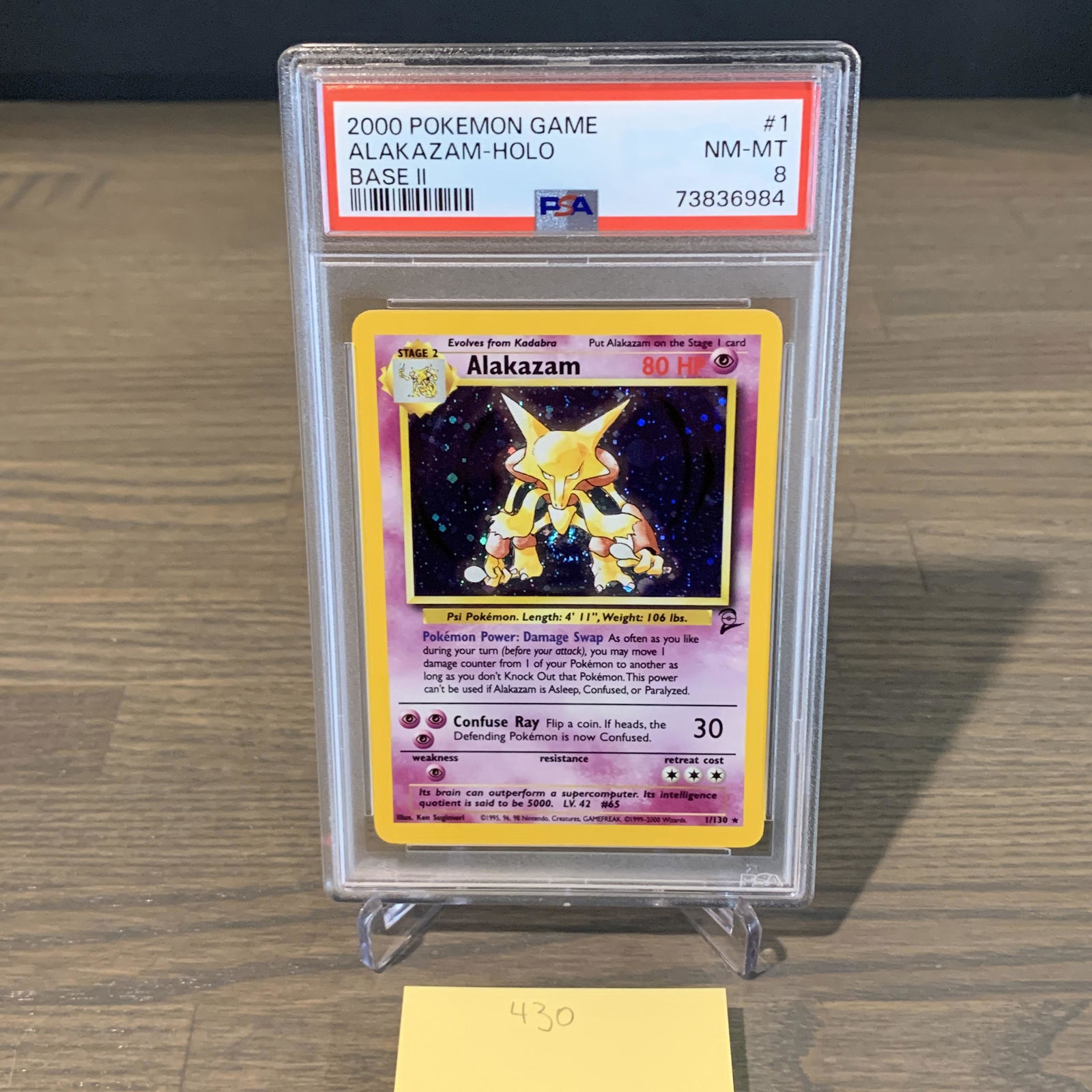 Base set 2 Alakazam Pokemon card PSA 8 (1 of 3)
