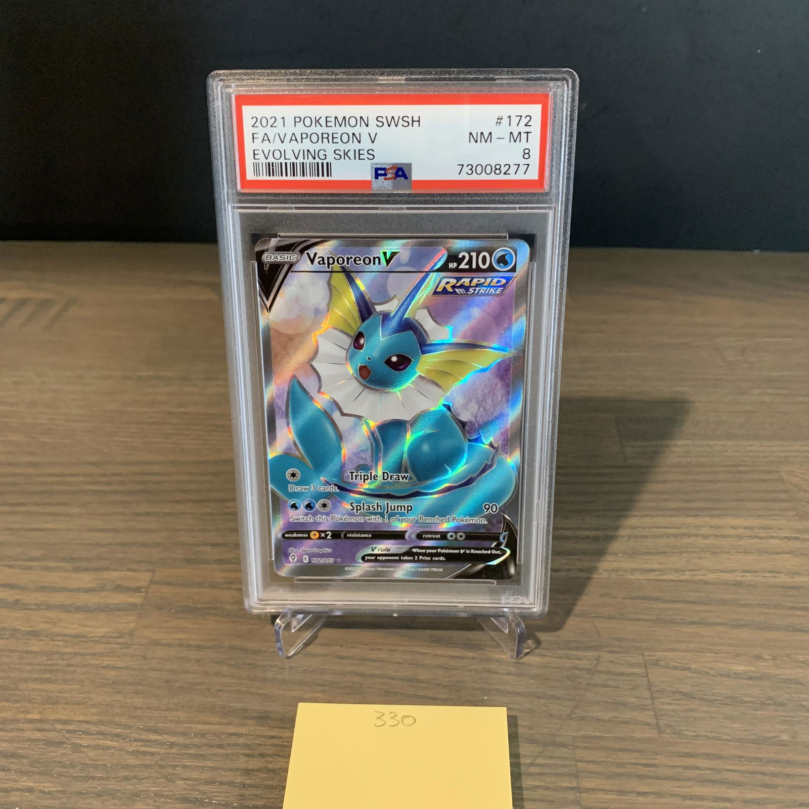 Vaporeon V Pokemon card PSA 8 (1 of 2)