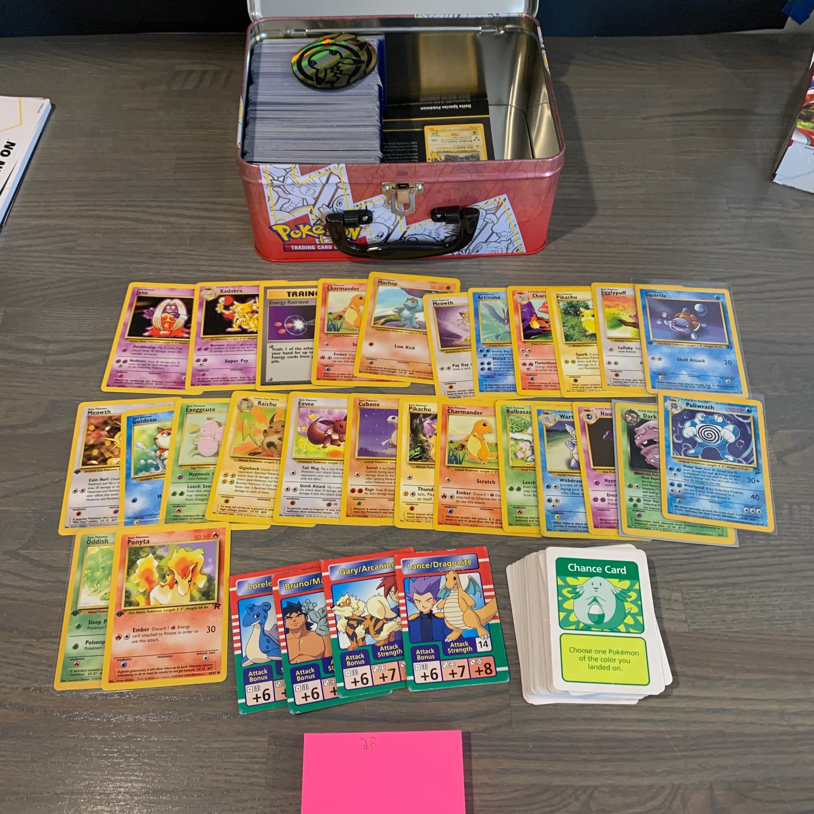 Pokemon Lunch Box filled with Pokemon Cards: Collectible Pokemon Lunch Box Filled with 100s of Vintage and Modern Pokemon cards. Includes holos, 1st Ed, and rare modern cards including Vs, ex, Vmax, etc. Includes Pocket binder with pokemon cards