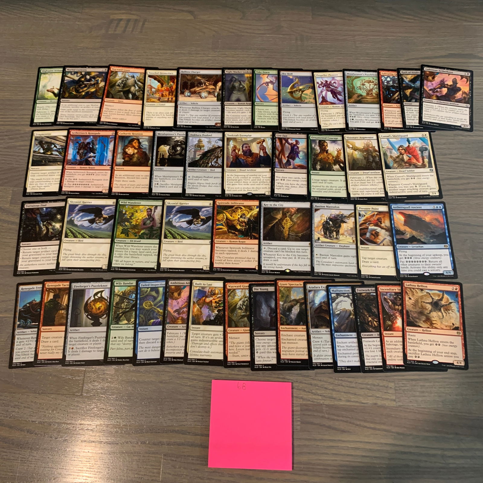 Kaladesh Magic the Gathering Cards: Lot of Kaladesh set Magic the Gathering Cards. See photos for condition. If you are interested in consigning with us, email aeronhouse1994@gmail.com or fill out the consignment form on ahauctionhouse.