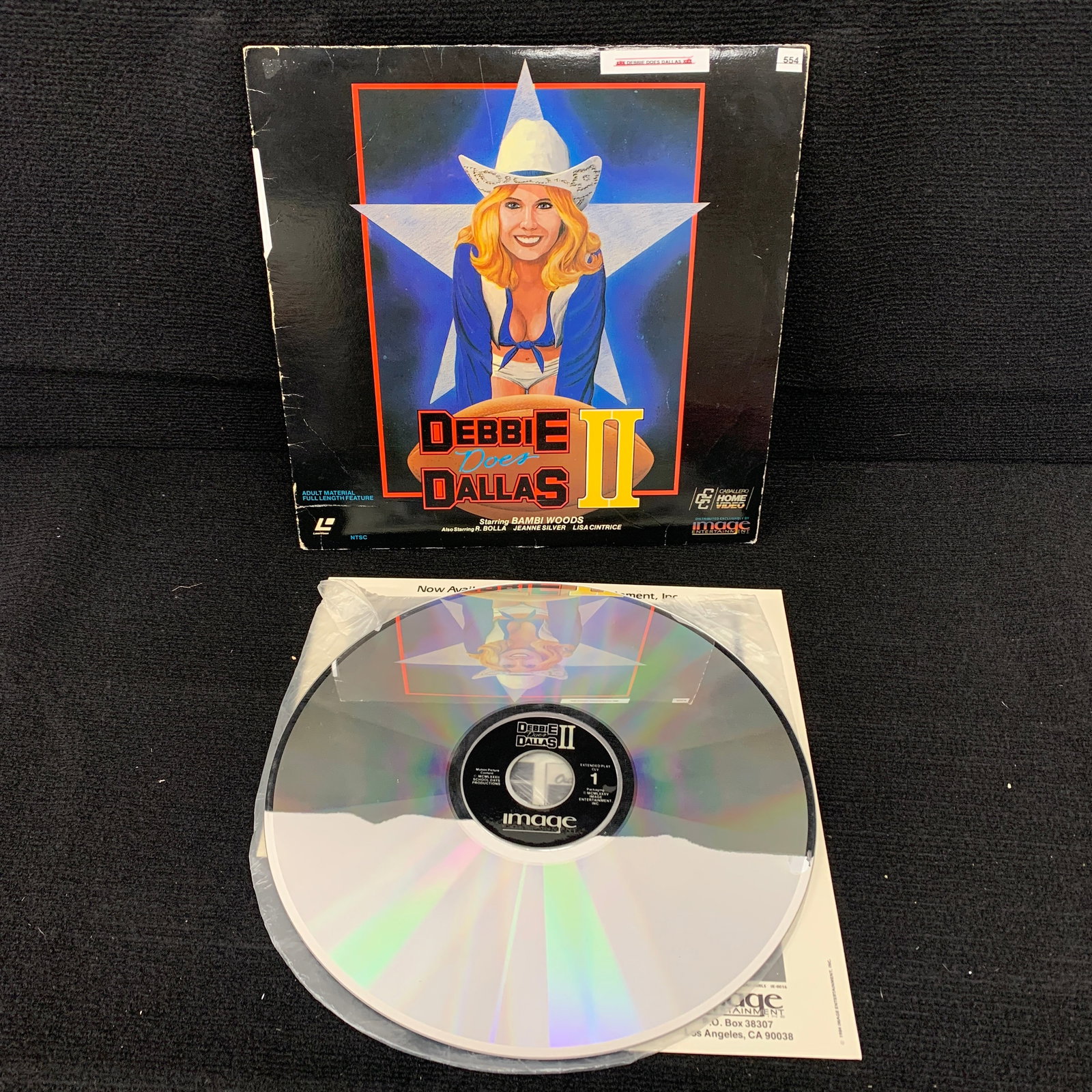 Debbie Does Dalls 2 Adult Laser Disc: Includes vintage cut out advertisement for other films. We are a veteran owned company. Please look at the pictures carefully to determine what you believe the condition of collecitible is. We are cur