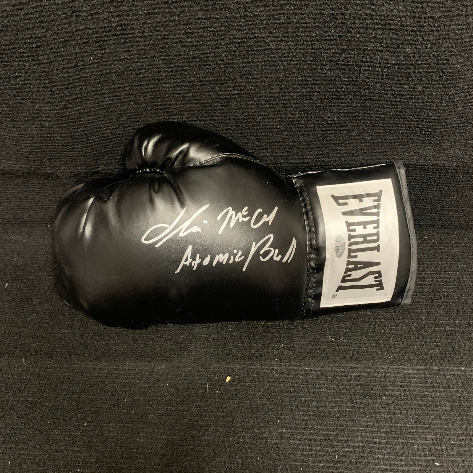 Oliver McCall Signed Boxing Glove w/JSA: Signed Everlast Boxing Glove by Oliver "Atomic Bull" Mccall. Includes COA from JSA and Scwartz Sports. We are a veteran owned company. Please look at the pictures carefully to determine what you belie