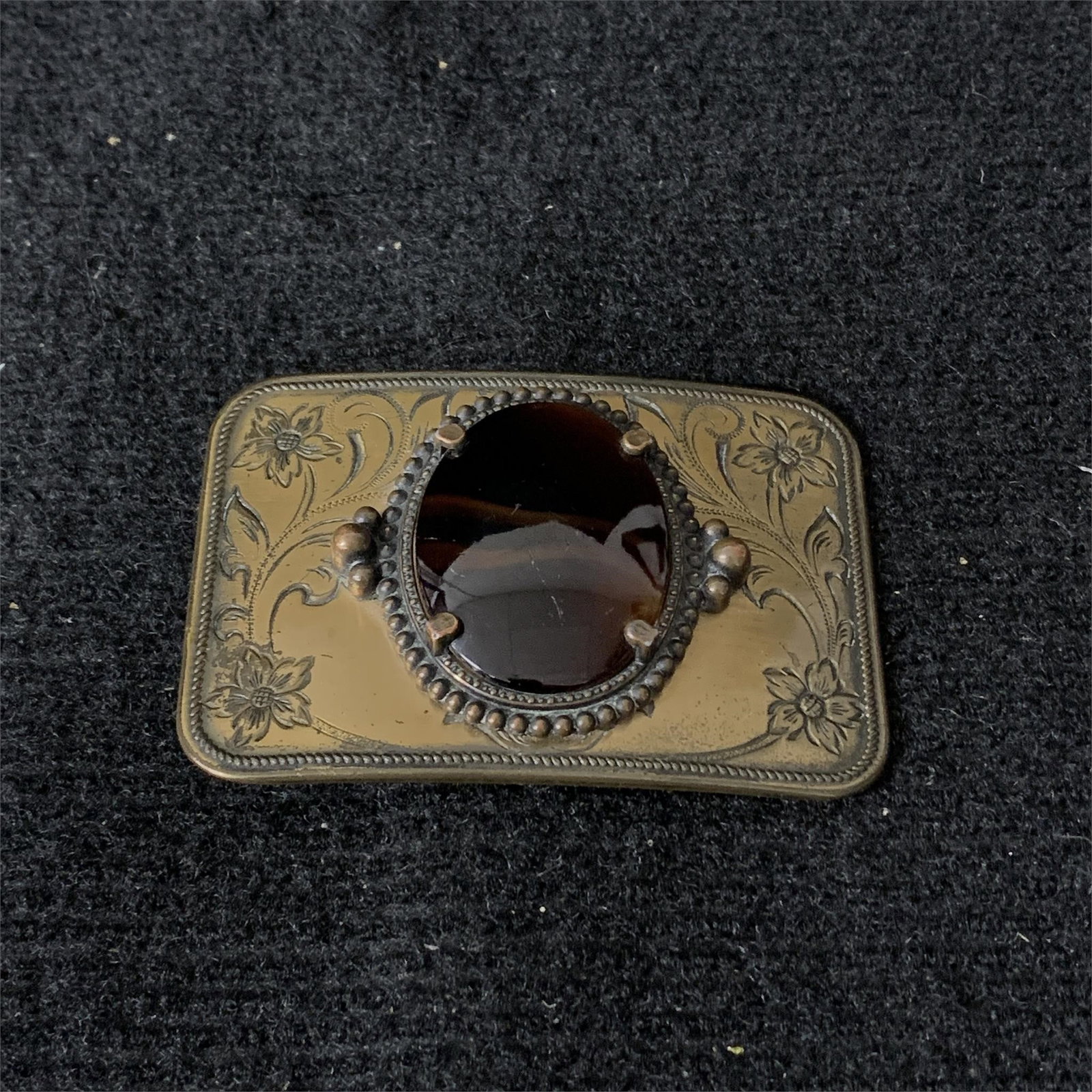 Vintage Brass Belt Buckle: Beautiful Vintage Brass Belt Buckel with unique stone centerpeice and scroll work. We are a veteran owned company. Please look at the pictures carefully to determine what you believe the condition of 