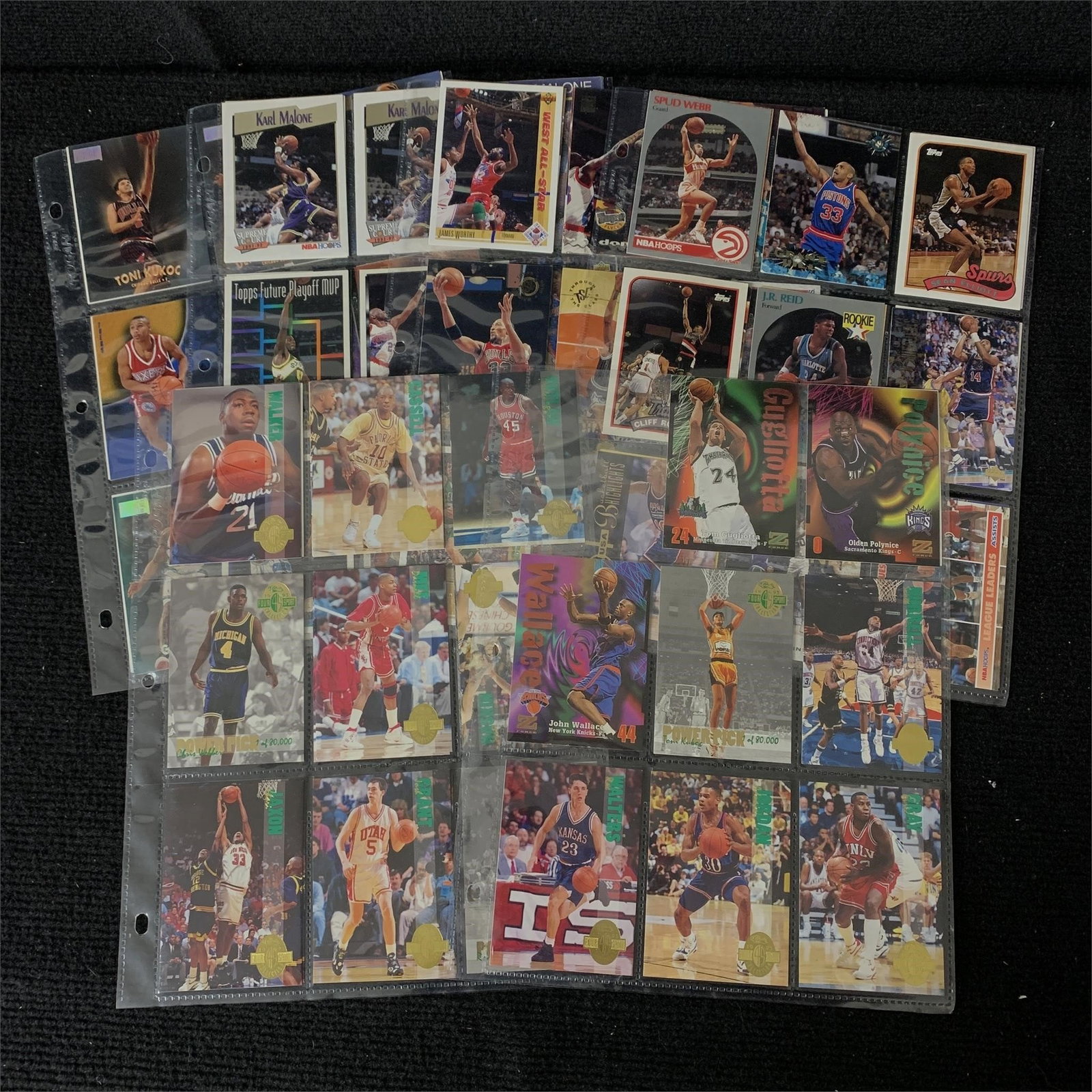 Mix lot of 1990s Basketball Cards: Pages filled with mostly 1990s basketball cards. Cards are from various sets and makers. We are a veteran owned company. Please look at the pictures carefully to determine what you believe the conditi