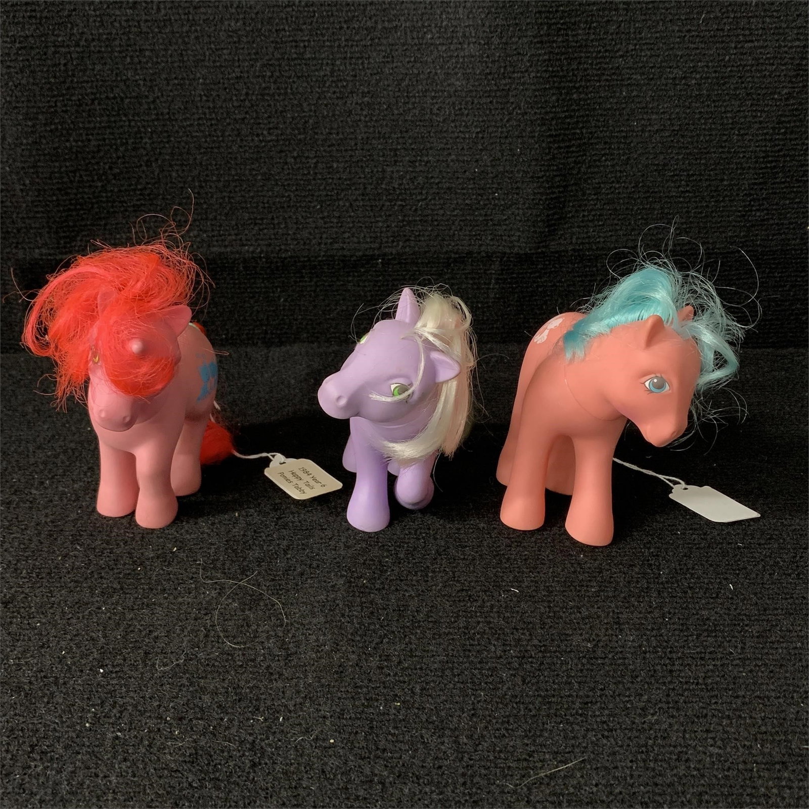 My Little Pony G1 Year 6 Happy Tails Romper, Tabby & Tossles: G1 MLP Year 6 (87-88) Happy Tails Ponies Romper, Tabby and Tossles. All are in working order and their tails swing when you squeeze them. There does not seem to be any issues with their cutie marks. T