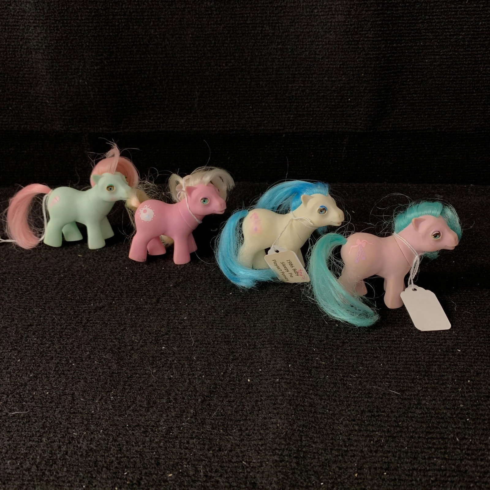 Lot of 4 Baby Ponies with Beddy Bye Eyes: G1 MLP Year 4 (85-86) Baby Ponies with Beddy Bye Eyes including Baby Cuddles (Baby Buggy variant), Baby Tiddley-winks (Lullabye Nursery), Baby Half Note (Playset Ponies Set) and Baby Sleepy Pie (Plays