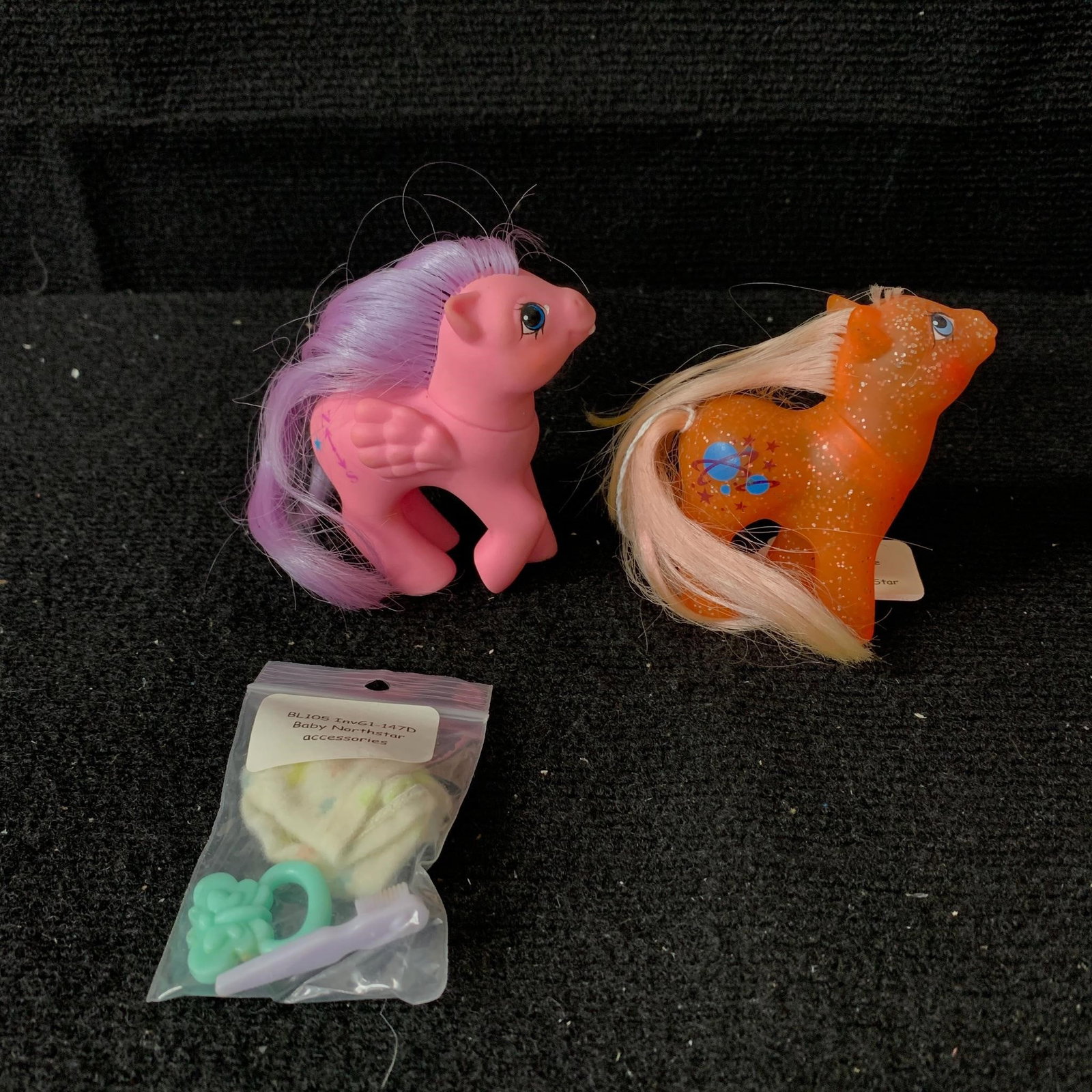 Baby Northstar: G1 MLP Year 8 (89-90) Baby Sparkle Pony and G1 MLP Year 5 (86-87) Baby Pony with First Tooth. Both are in excellent played with condition but the Baby Sparkle Pony has had a mane hair cut and is missi