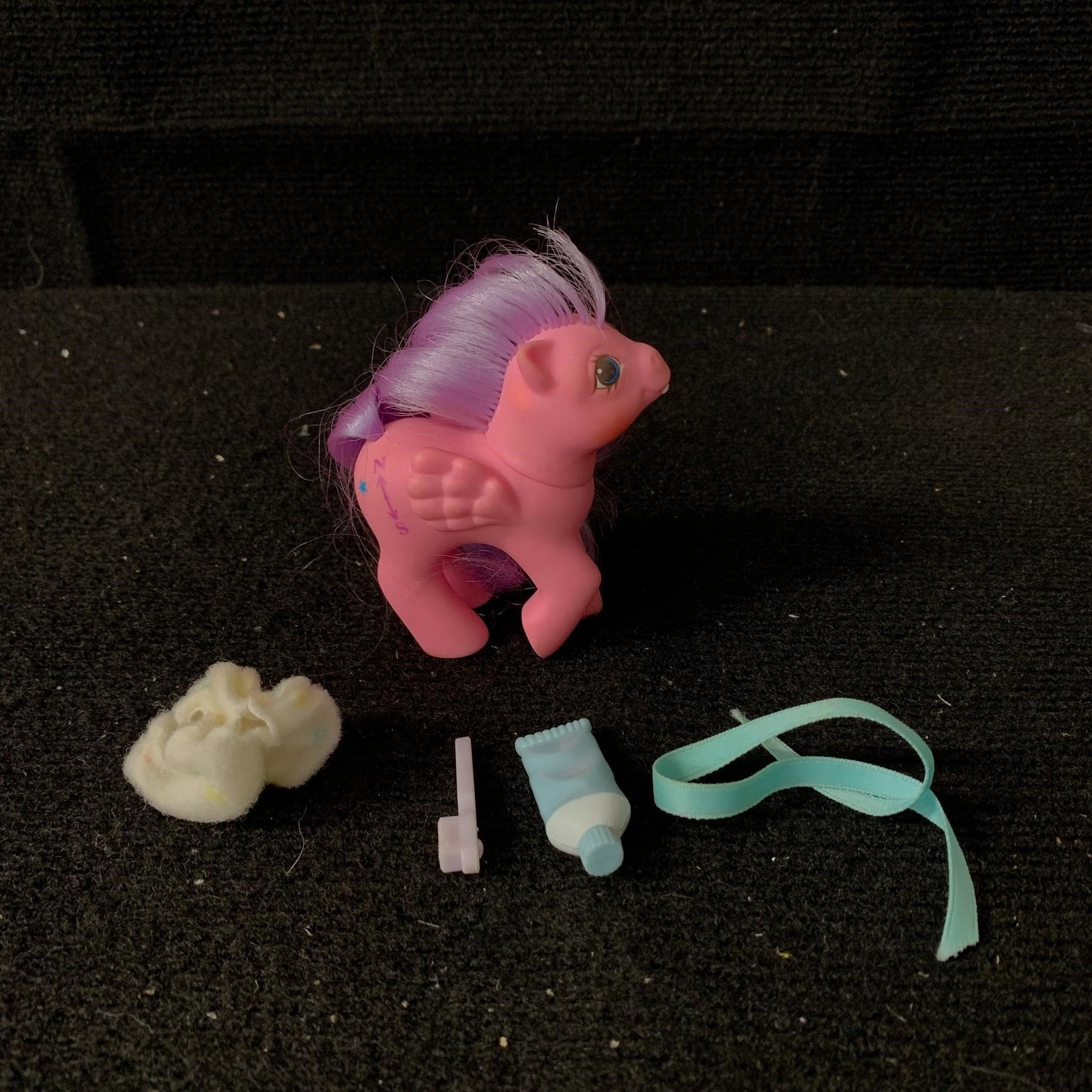 Baby Northstar with accessories: G1 MLP Year 5 (86-87) Baby Pony with First Tooth Baby Northstar with accessories including ribbon, toothbrush, diaper and toothpaste. In excellent played with condition with no apparent haircuts or ma