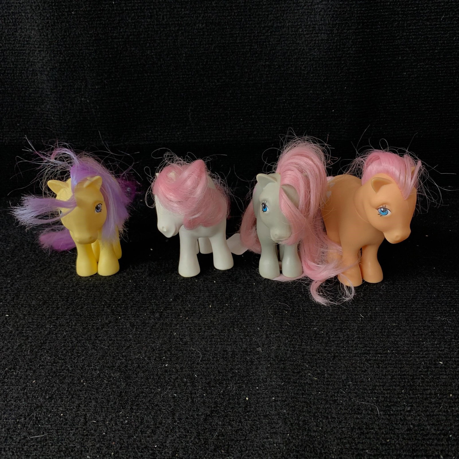 Lemon Drop, Peachy, Snuzzle & Sundance: G1 MLP Year 2 (83-84) and Year 3 (84-85) Earth Ponies including Lemon Drop, Peachy, Snuzzle and Sundance. All are in good played with condition with no apparent haircuts. Their cutie marks are nice an
