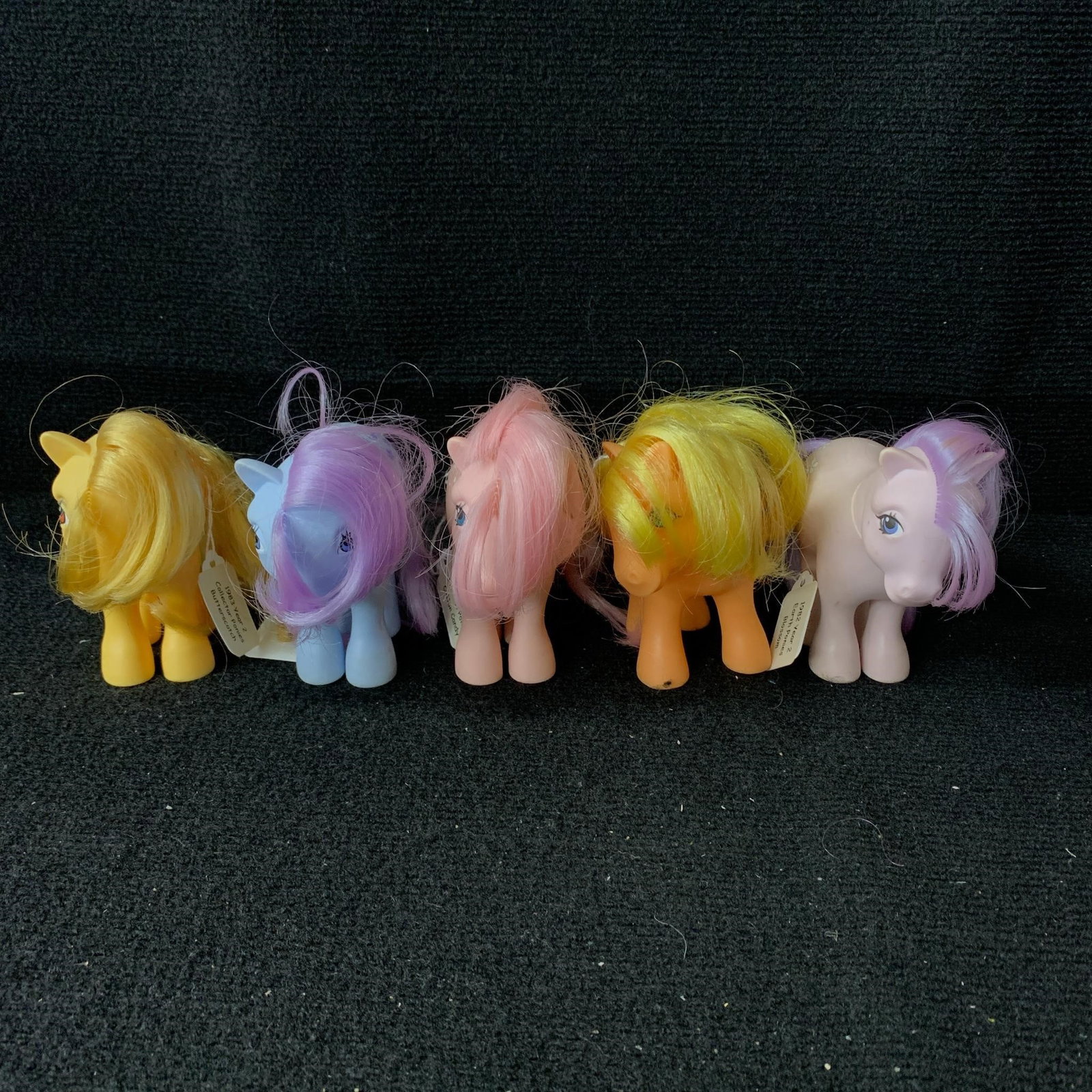 Lot of 5 G1 MLP Earch Ponies: G1 MLP Earth/Collector Ponies including Apple Jack, Blue Belle, Blossom, Butterscotch and Cotton Candy. All are in excellent played with condition with no apparent haircuts. There are small marks on a