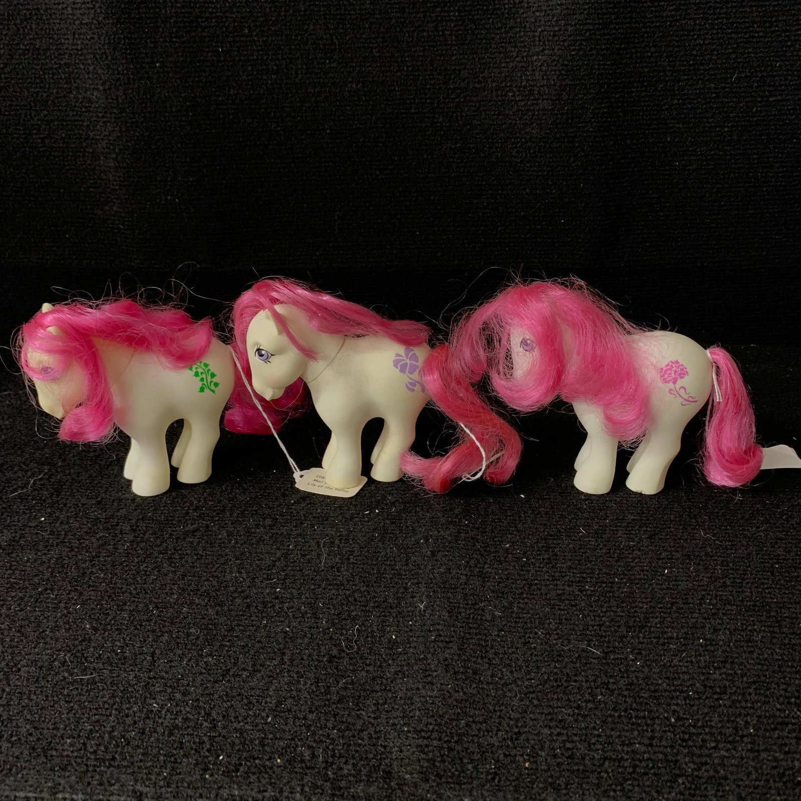 Mail Order Birth Flower Ponies: G1 MLP Mail Order Birth Flower Ponies including January (Carnation), February (Violet) and May (Lily of the Valley). January and May are in excellent played with condition with no apparent haircuts or