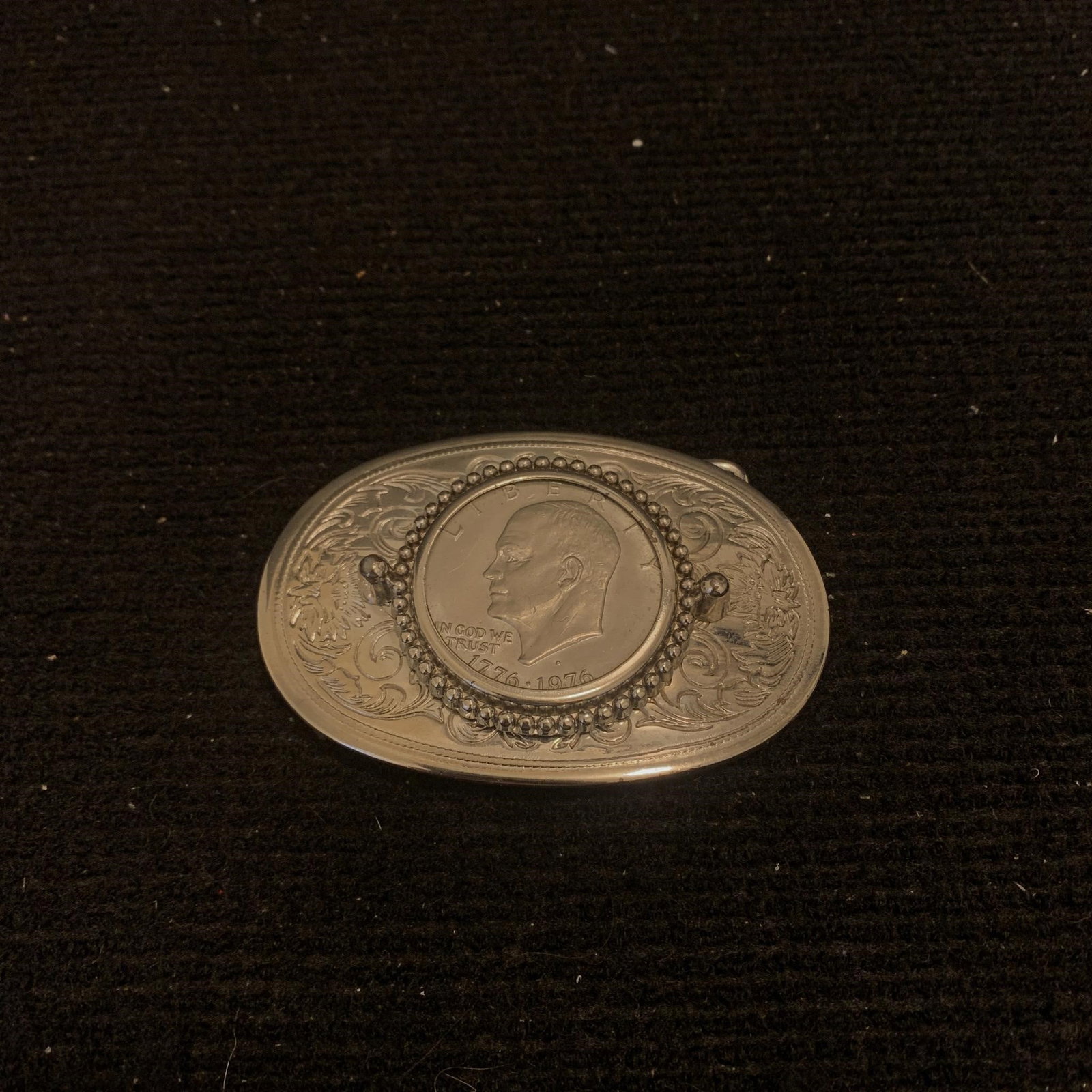 Eisenhower Dollar Coin Belt Buckle: Beautiful Belt Buckle with authentic Eisenhower Dollar Coin 1976 D Mounted on the front. We are a veteran owned company. Please look at the pictures carefully to determine what you believe the conditi