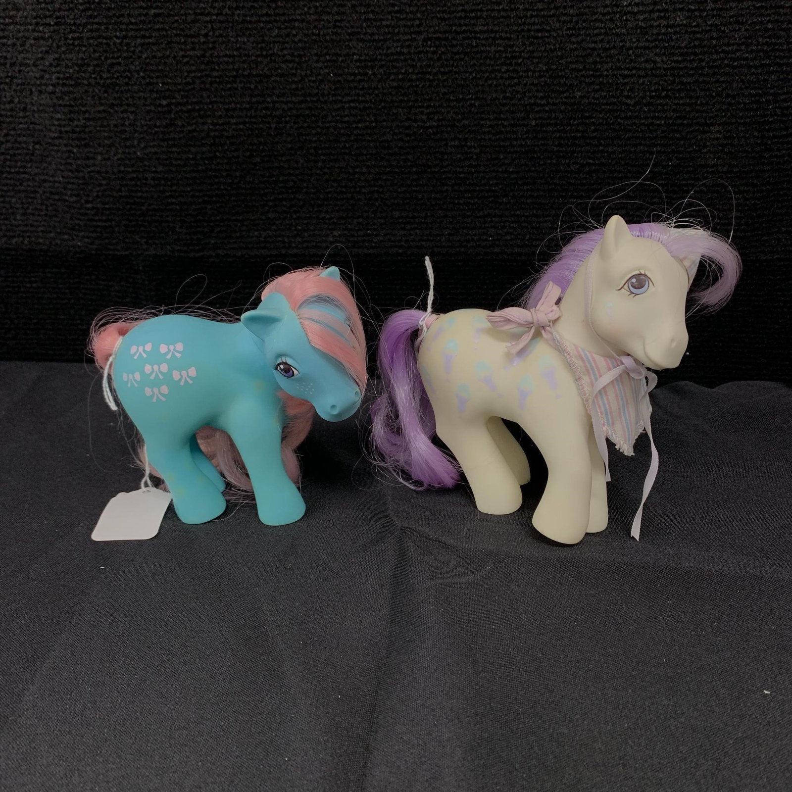 G1 MLP Scoops and Bowtie: G1 MLP Year 2 (83-84) Earth Pony Bow-Tie and G1 MLP Year 5 (86-87) Satin Slipper Sweet Shoppe Scoops. Both are in excellent played with condition with no apparent tail or mane cuts. Scoops does not ap