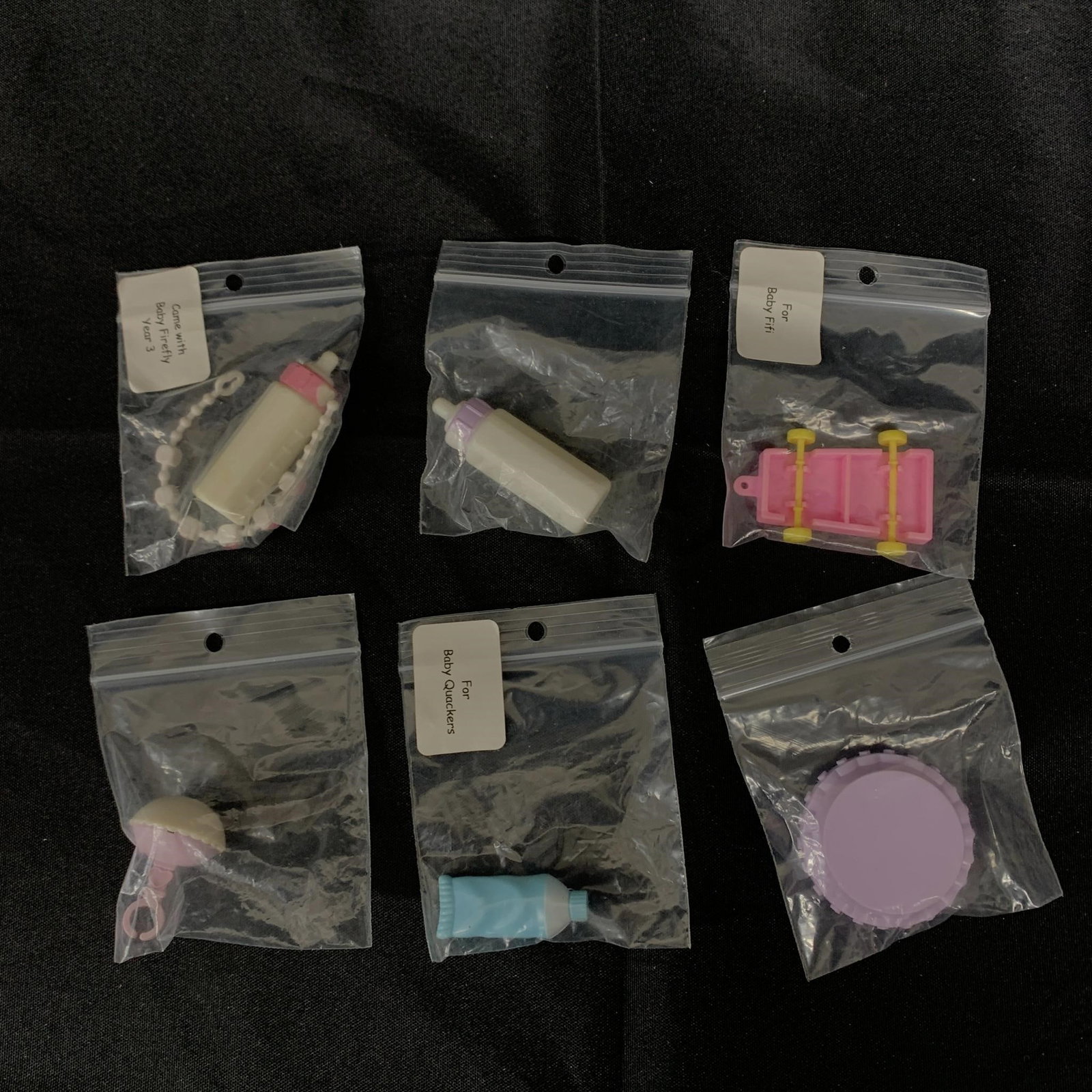 Lot of G1 MLP Baby Accessories: This lot contains 6 different accessories for G1 MLP baby ponies including the toothpaste for Baby Quackers, the xylophone for Baby Fifi, the baby bottle & necklace for Baby Firefly, plus a purple/whi