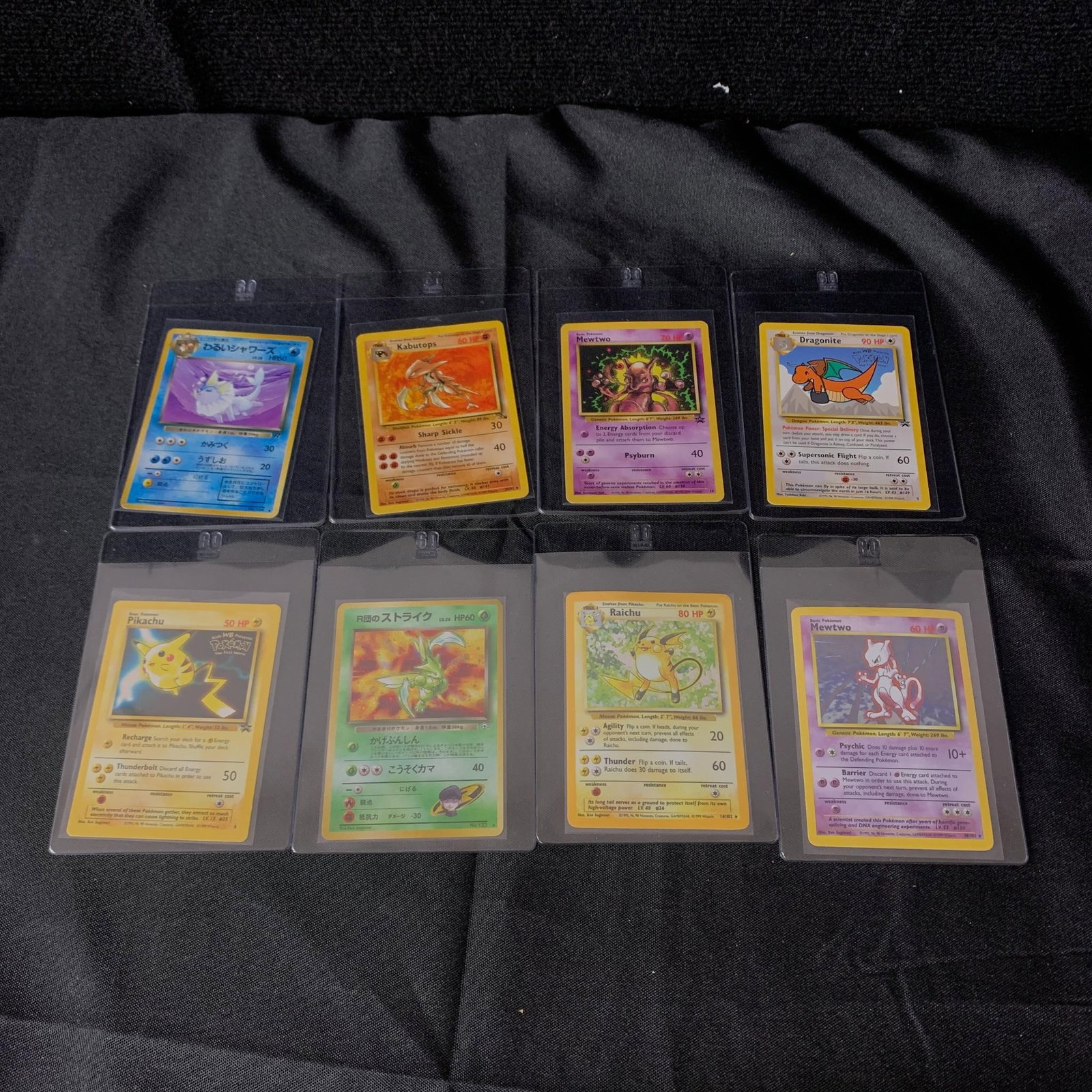Vintage Pokemon Card lot: Holo Mewtwo, Raichu, and Team Rocket's Scyther. Includes vintage promos as well. We are a veteran owned company. Please look at the pictures carefully to determine what you believe the condition of co