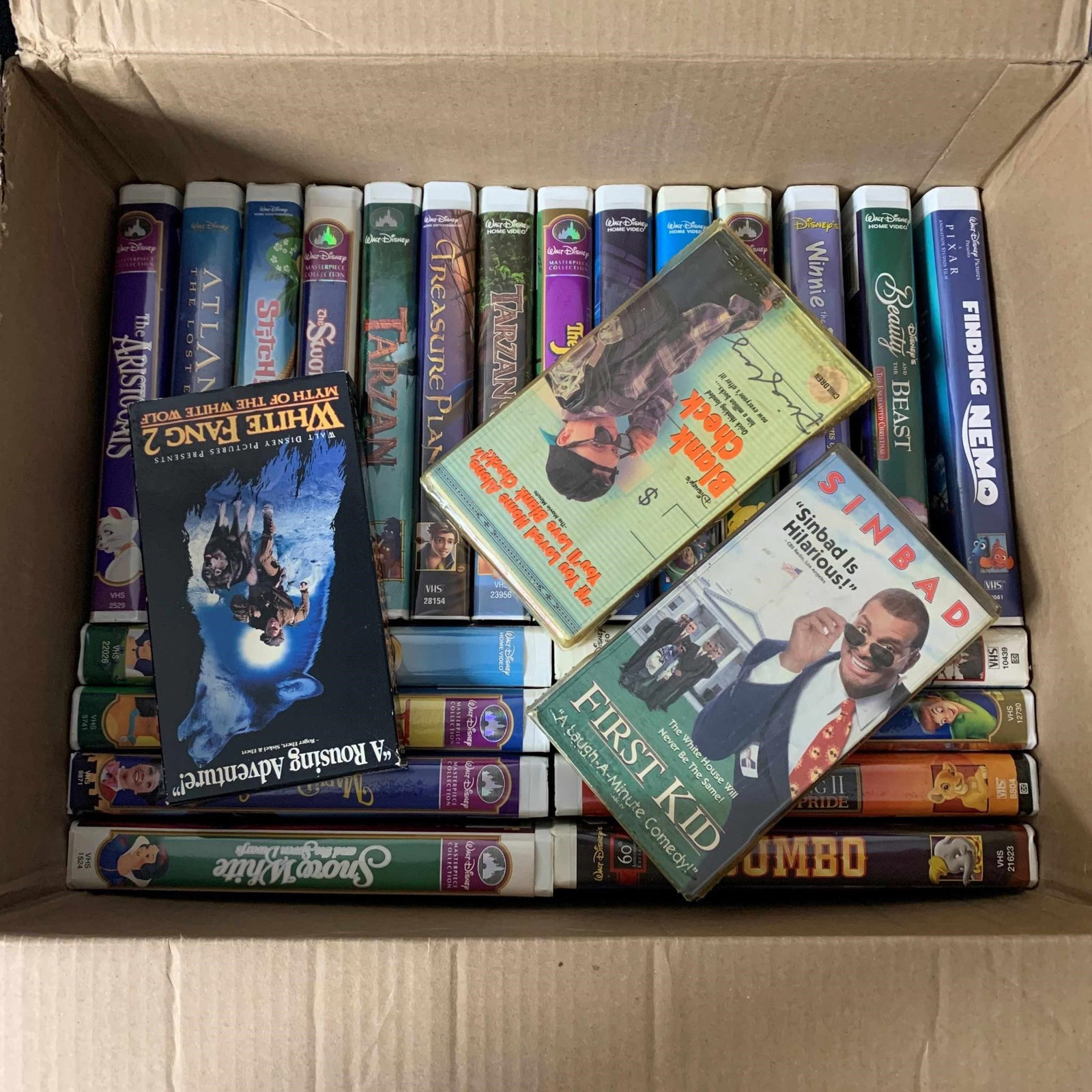 Large box filled with Disney VHS tapes (1 of 2)