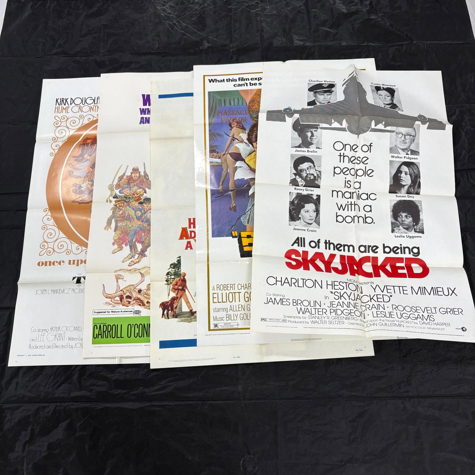60s and 70s Original Movie Posters Skyjacked: Nice lot of Original One sheet Movie Posters. Dimensions: 27x41 Please look at photos carefully. All sales are final. Items sold as is. We offer virtual and in person previews of any lots up until auc