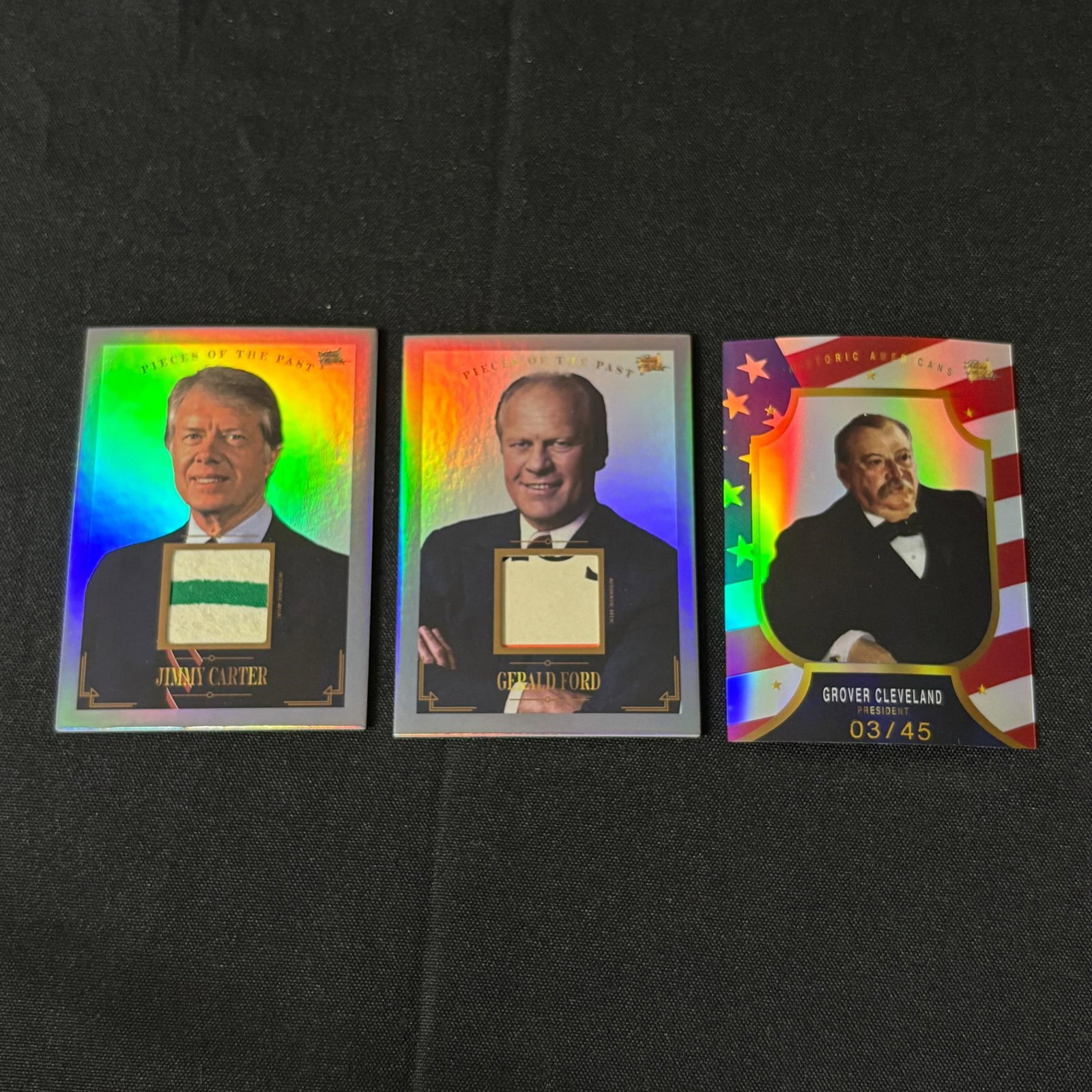 Pieces of the Past Relic and Numbered Pres Cards: Pieces of the Past Relic Cards of Jimmy Carter and Gerald Ford, Grover Cleveland #/45. Please look at photos carefully. All sales are final. Items sold as is. We offer virtual and in person previews o