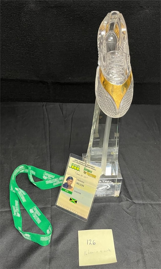 International Track & Field Award Trophy Rare: The item comes with the tournament credentials of Bahama international track and field member Nickiesha Wilson. This item is tall and heavy. It is a premium international competition award. These type