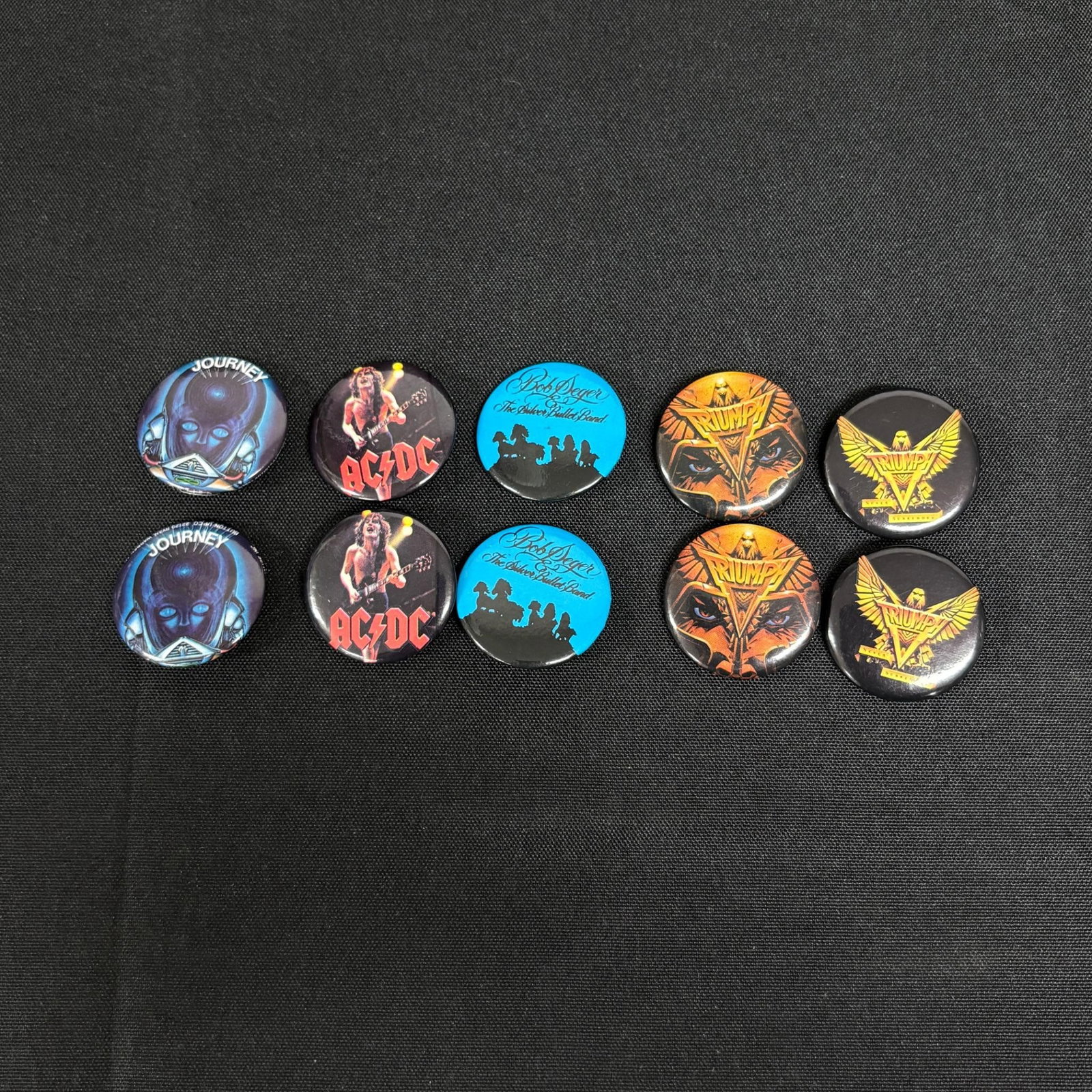 1980s Band Buttons, Journey, Triumph +: All items are sold as is. Please look at pictures carefully to determine what you believe are the condition of each lot. By choosing which card to use to register to bid, you authorize us to use the c