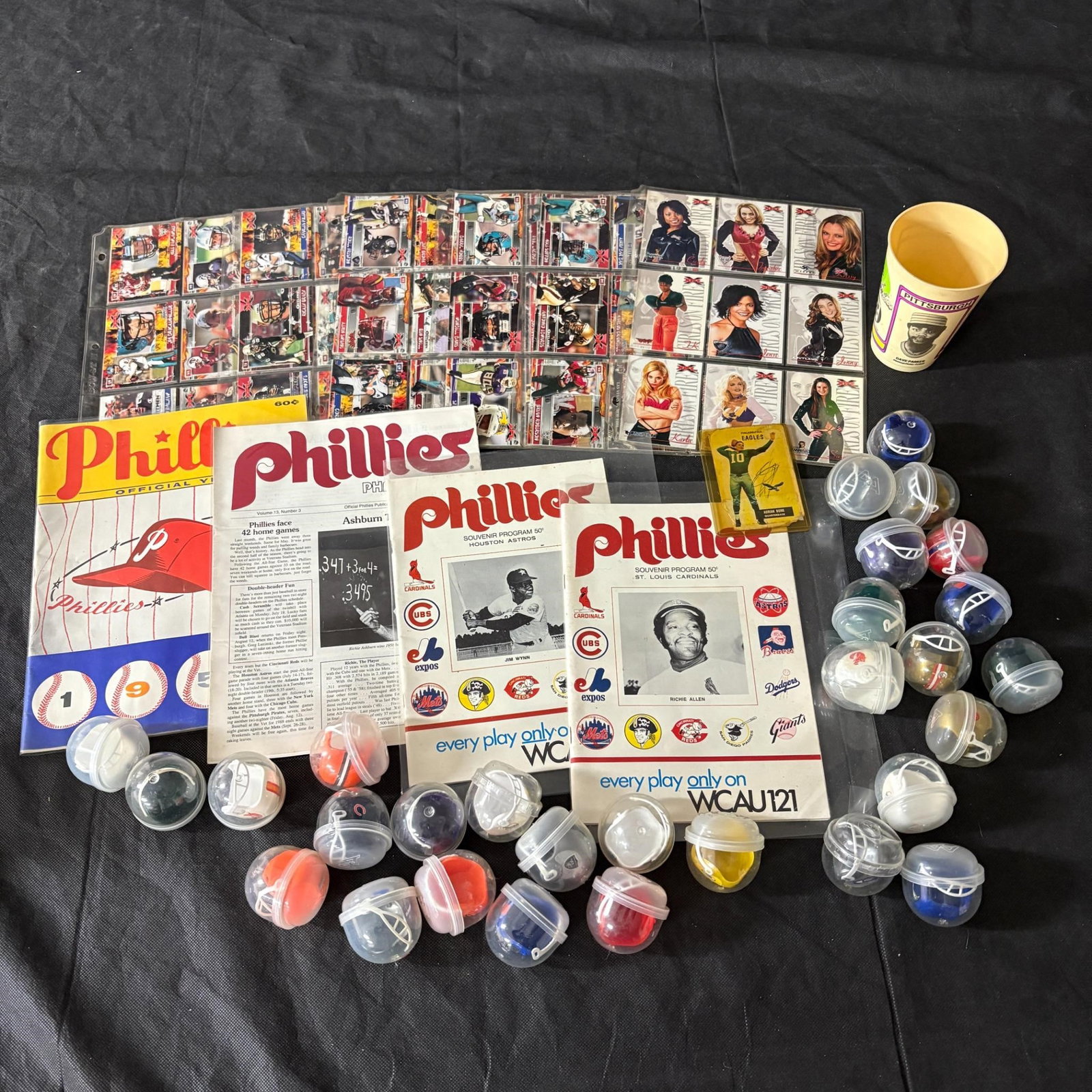 Sports Cards, Mini Helms, and Phillies Programs: Includes XFL Football Cards, Phillies Souvenir Programs, and mini football helmets. All items are sold as is. Please look at pictures carefully to determine what you believe are the condition of each 