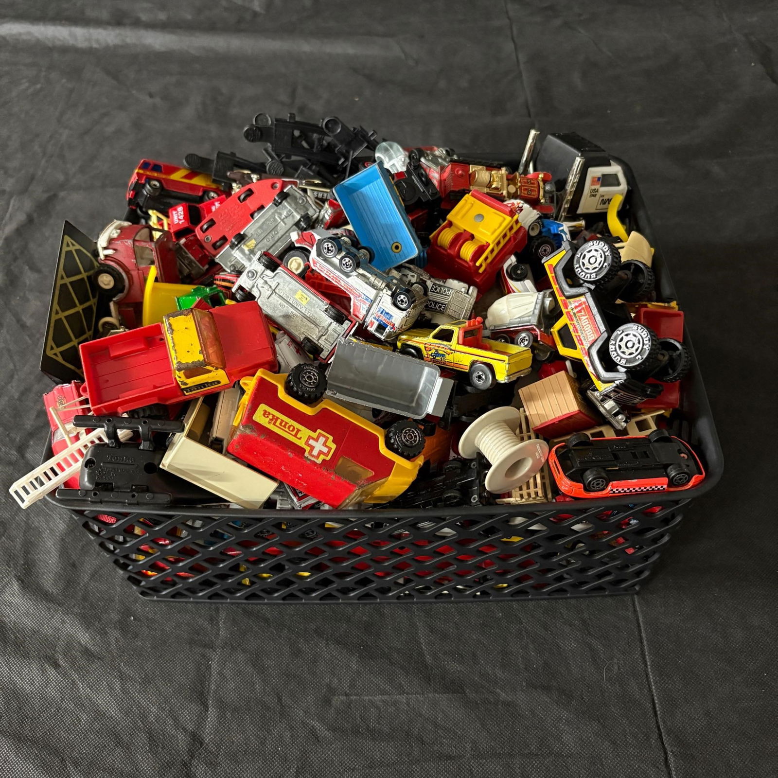 Large lot of Matchbox, Hotwheels, + Cars: Large lot of Matchbox, Hotwheels, and more mini cars. (Cars have been moved out of the basket photographed and into a box for shipping). All items are sold as is. Please look at pictures carefully to