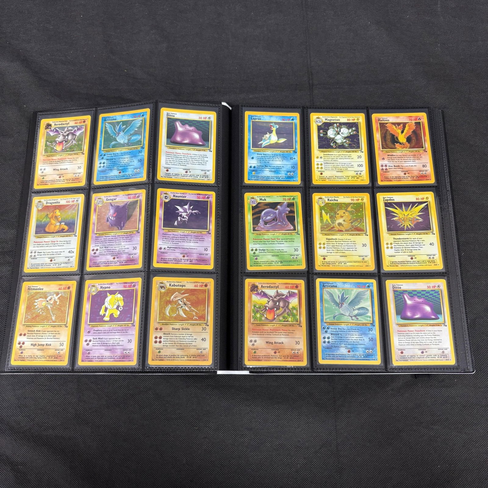Complete Vintage Unlimited Fossil Set Binder: Complete Set of Vintage Unlimited Fossil Set Pokemon Card Binder. 1-62. Includes Gengar, Dragonite, Moltres. This lot comes from a trading card store. As per the consigner, they have listed this set a