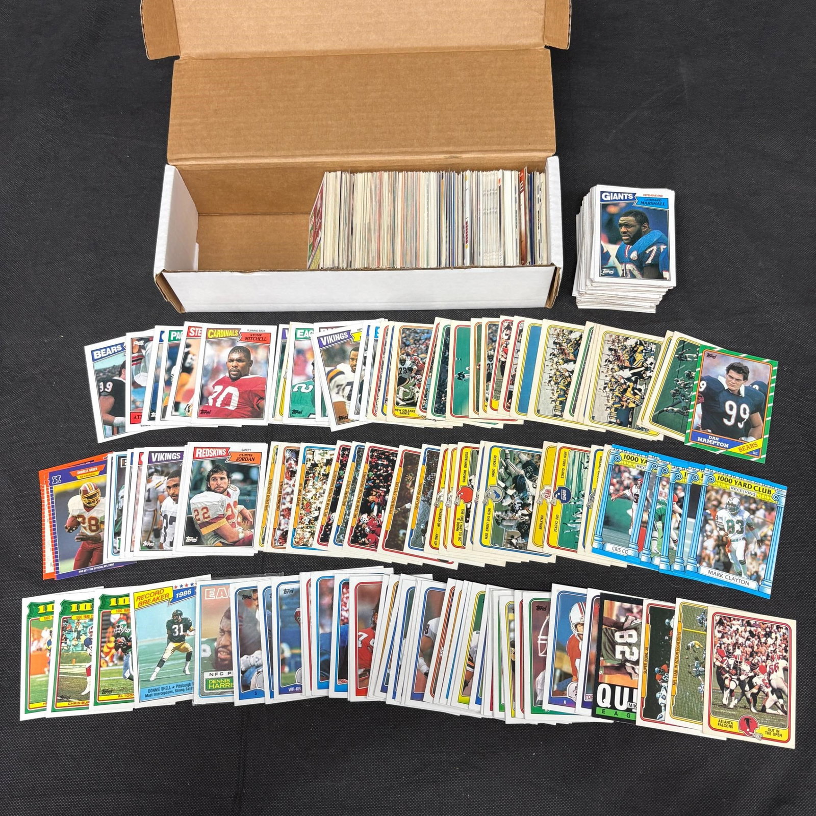 80s-90s Football Card lot: 100s of 1980s - 1990s (and 2000s) Football Cards. We offer in person or virtual previews of auction lots up until the day before the auction. All items are sold as is. Please look at pictures carefull