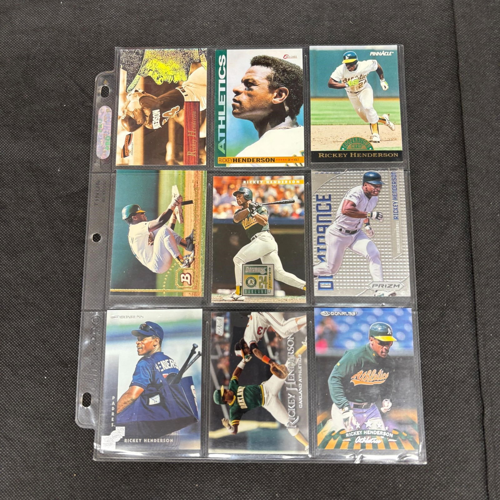 SHEET OF 9 HOF RICKEY HENDERSON CARDS (1 of 2)
