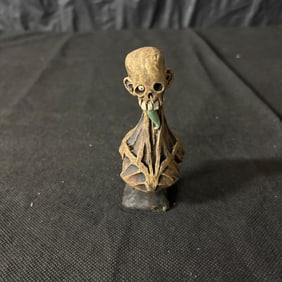 Dug Stanat signed hand made ceramic skull figure and includes a jade tongue