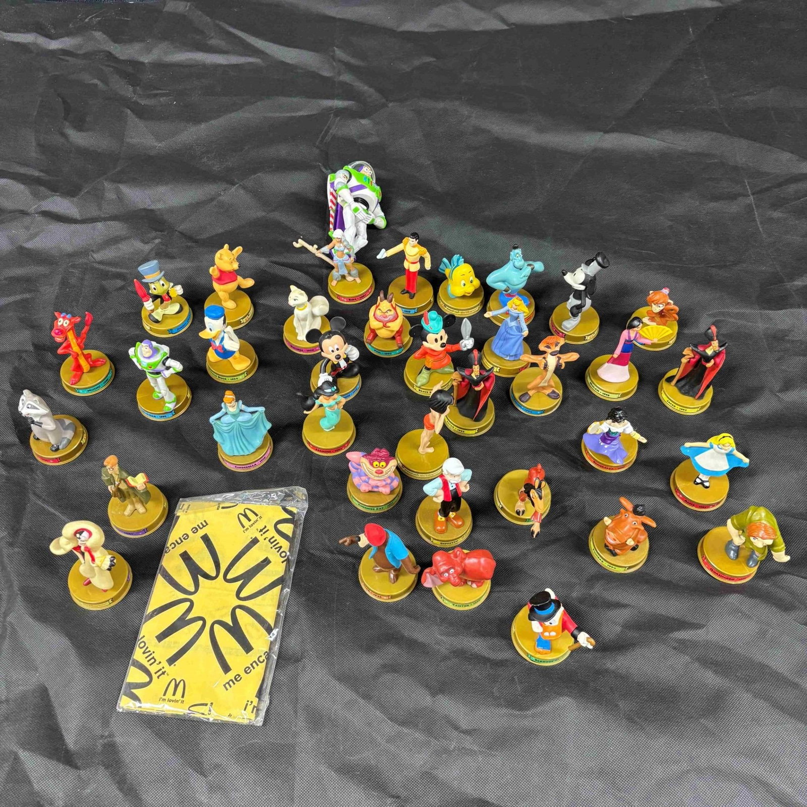 02 McDonald's Disney 100th anniversary Promo Toys: 2002 McDonald's happy meal toys from the Disney 100th anniversary promotion with bagged banner. We ship in-house! We ship internationally. We also offer pick up and we offer a discount for cash paymen