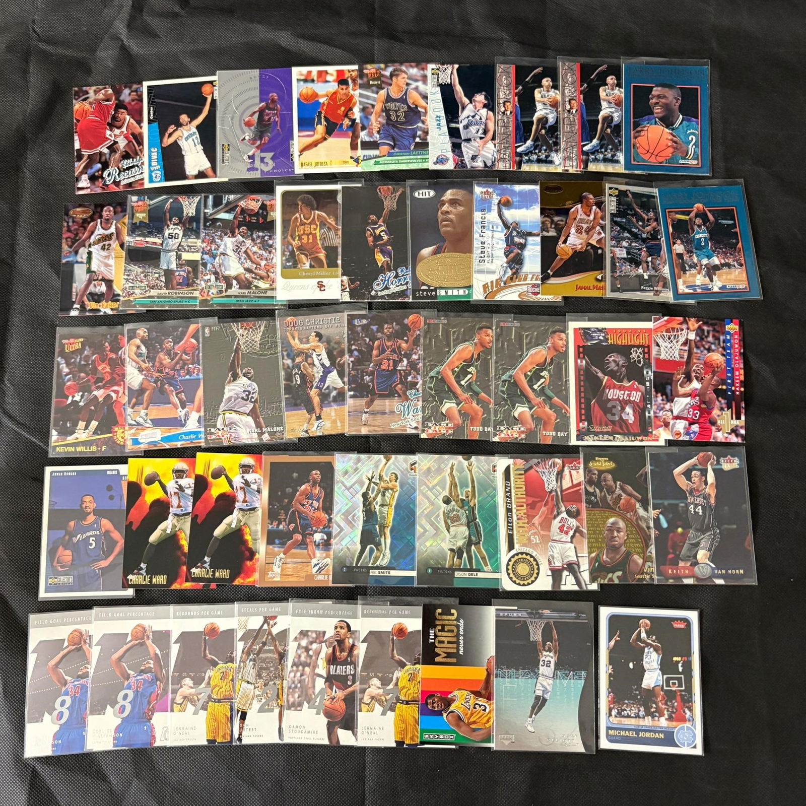 NBA Stars & Rookies (40-50 cards): Approximately 40-50 primarily NBA cards, including stars and rookies: Charlie Ward, Hakeem Olajuwon, Larry Johnson, Magic Johnson, Carl Malone, etc. Mostly base parallels or commons with some moderate