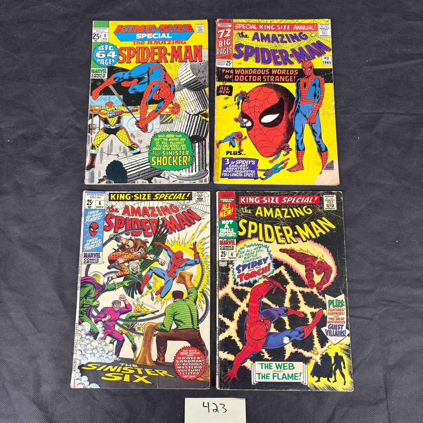 A Group of Four Marvel Comics: The Amazing Spider-Man King-Size Specials and Annuals, including: A group of four vintage American comic books from the Marvel Comics Group, all featuring "THE AMAZING SPIDER-MAN." This lot includes *The Amazing Spider-Man King-Size Special #6* (featuring the Sinist
