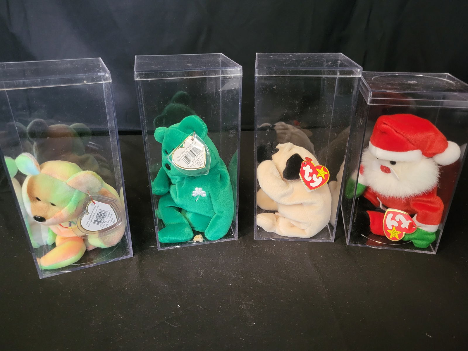 I00046 A Group of Ty Beanie Babies Plush Toys: BID PER WHAT YOU SEE IN THE PHOTO, NOT THE AI GENERATED TITLES AND DESCRIPTIONS! A group of Ty Beanie Babies plush toys constructed from synthetic plush fabric with plastic bead eyes and noses. The co