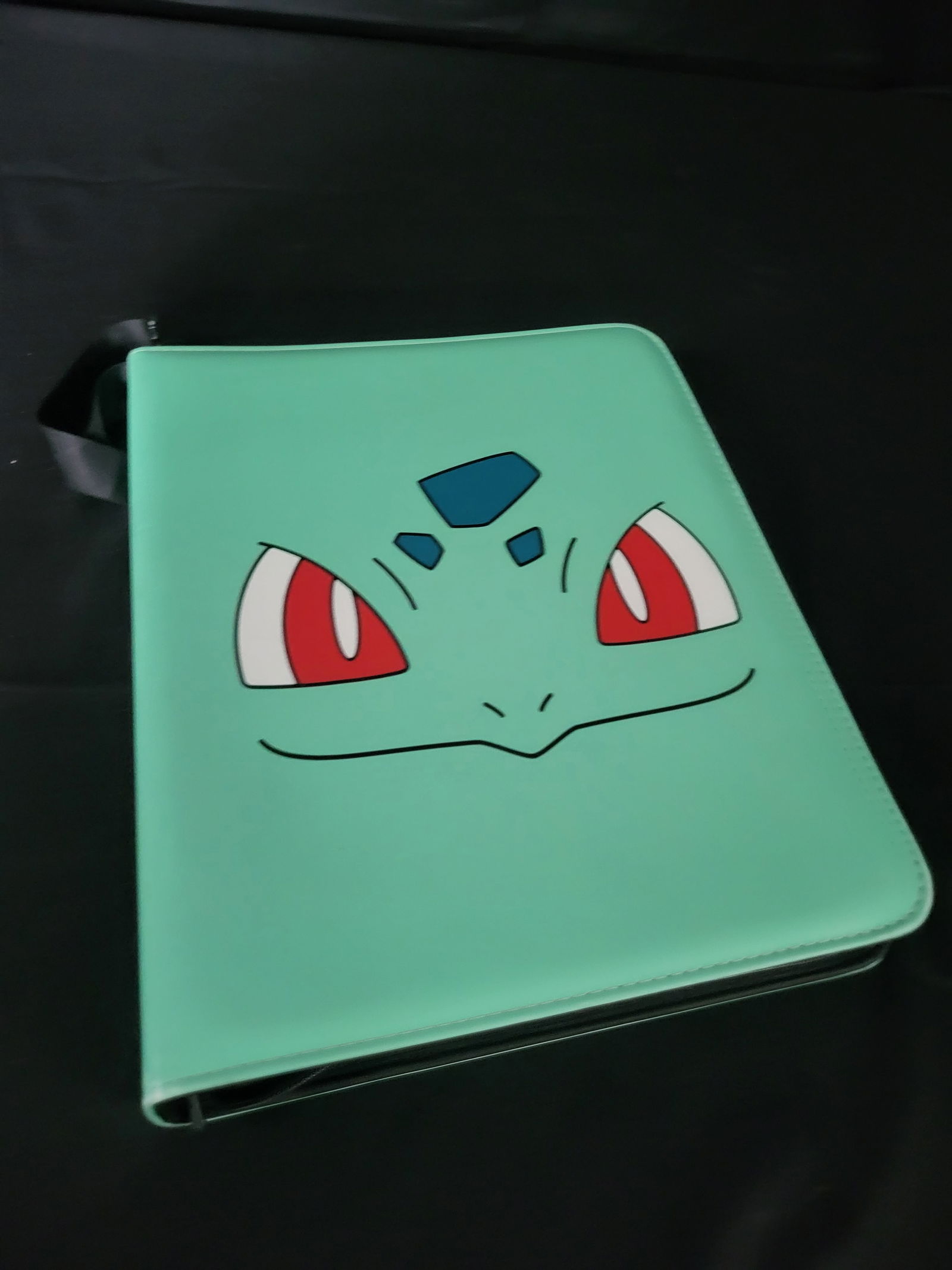 I00200 A Collection of Pokemon Trading Cards in a Trends International Gallery Pops Bulbasaur Binder (1 of 13)