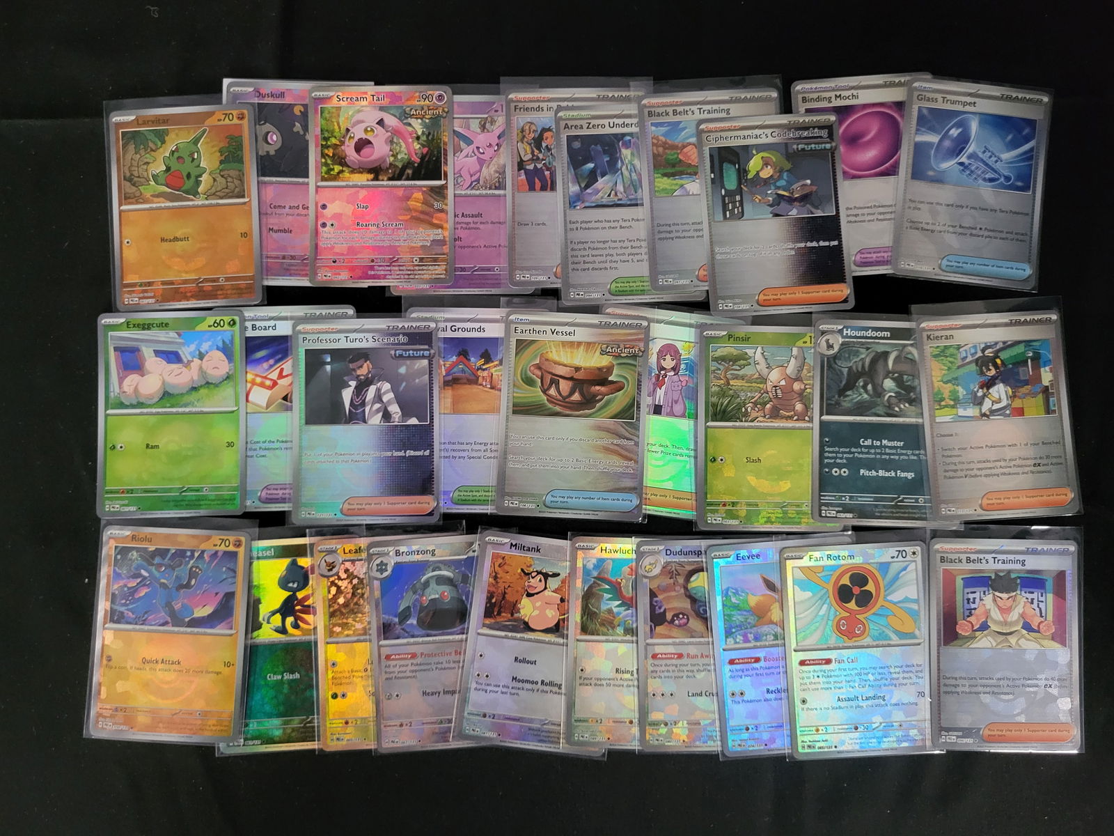 I00244 A Collection of Pokemon Trading Cards from the Scarlet and Violet Series: BID PER WHAT YOU SEE IN THE PHOTO, NOT THE AI GENERATED TITLES AND DESCRIPTIONS! This collection features a variety of contemporary Pokemon Trading Card Game cards, primarily from modern expansions wi