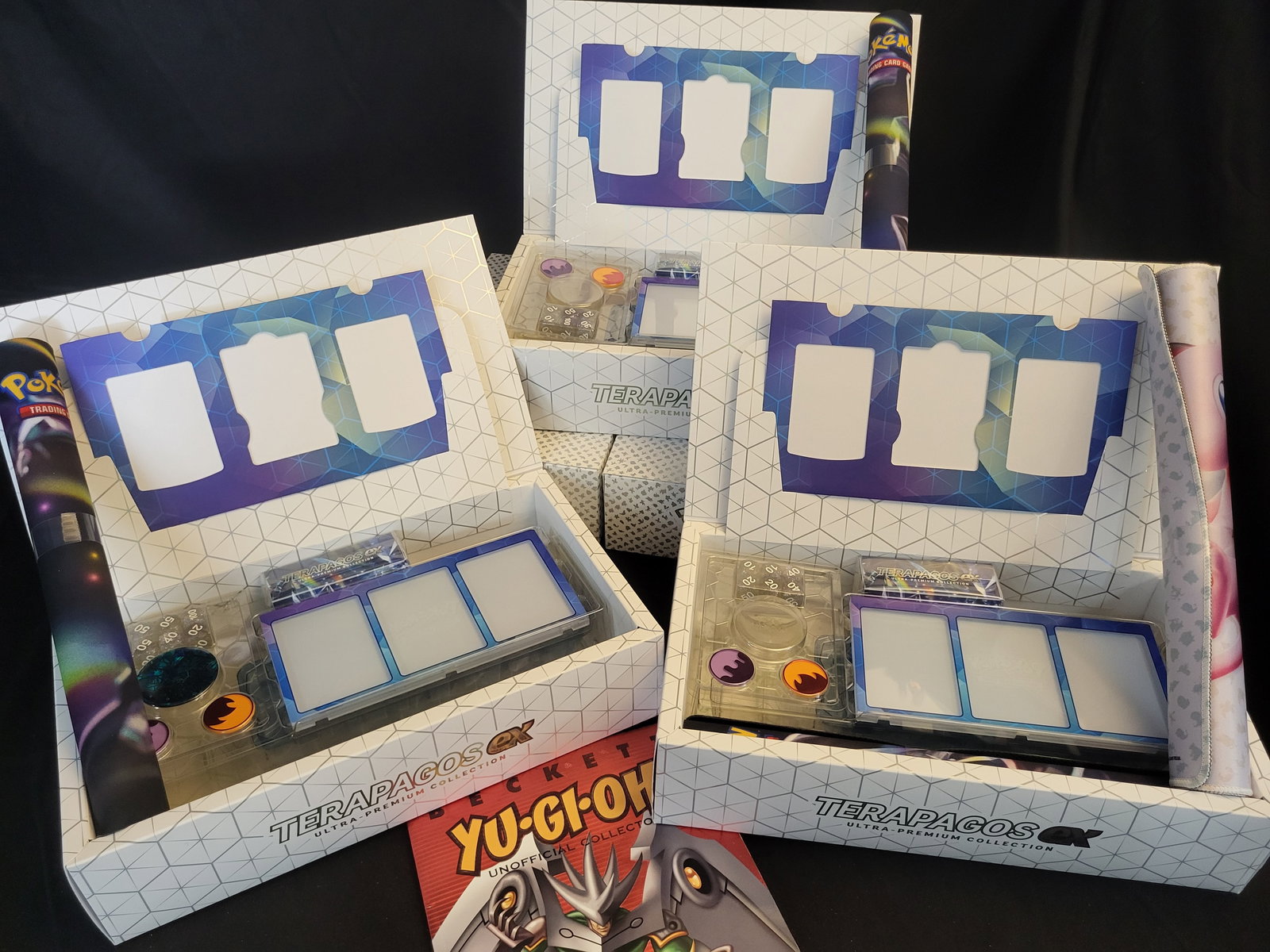 I00259 An Assortment of Pokemon TCG Terapagos ex Ultra-Premium Collection Sets and a Yu-Gi-Oh! (1 of 3)
