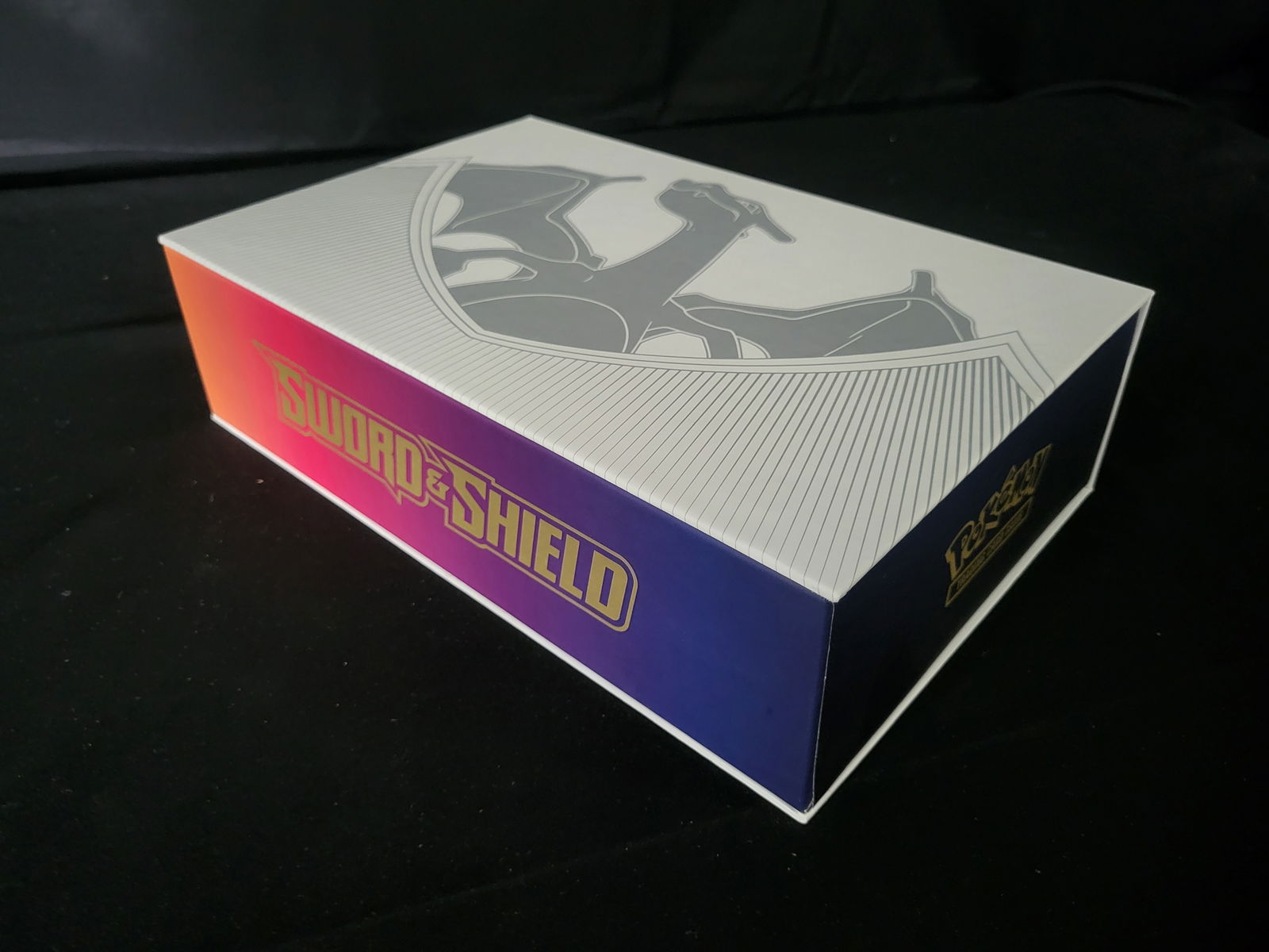 I00201 A Collection of Pokemon Trading Cards in a Sword and Shield Charizard Ultra-Premium (1 of 3)