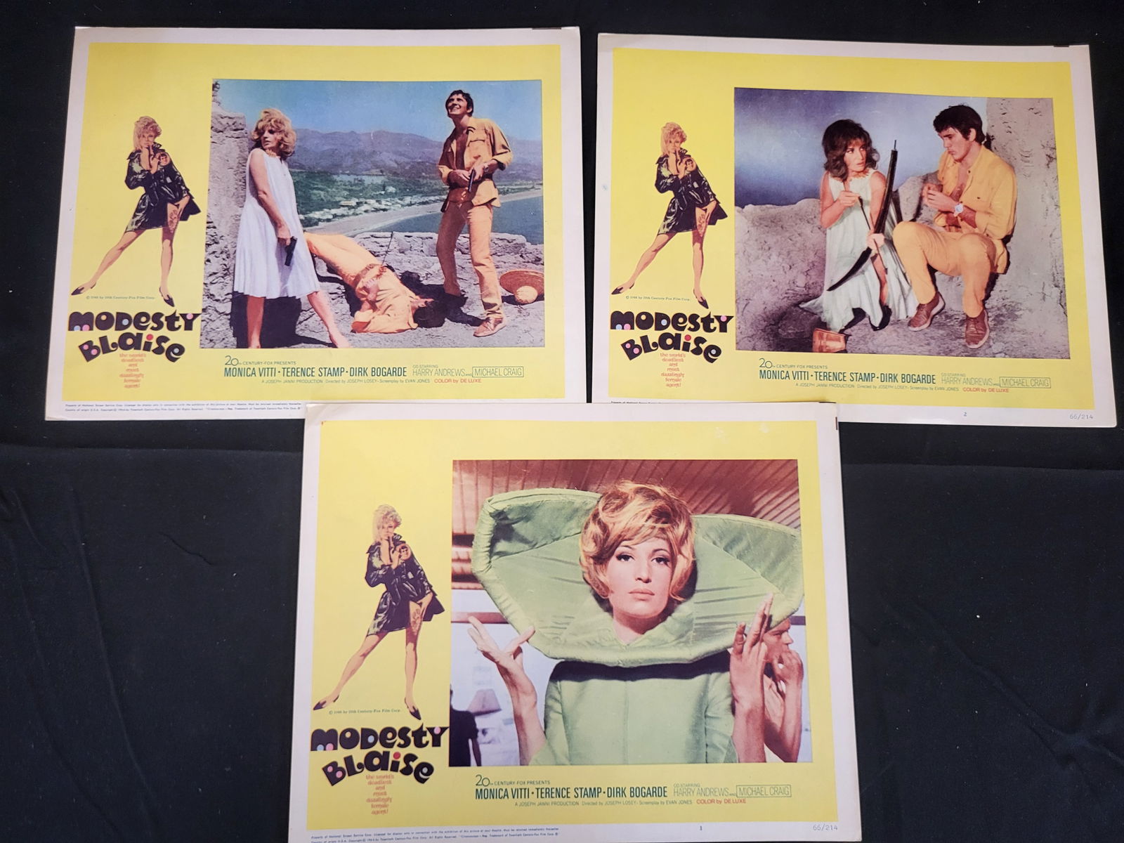 I00357 A Trio of Modesty Blaise 1966 Original Movie Lobby Cards: BID PER WHAT YOU SEE IN THE PHOTO, NOT THE AI GENERATED TITLES AND DESCRIPTIONS! A trio of original movie lobby cards for the 1966 20th Century-Fox production Modesty Blaise. Each card is printed on c